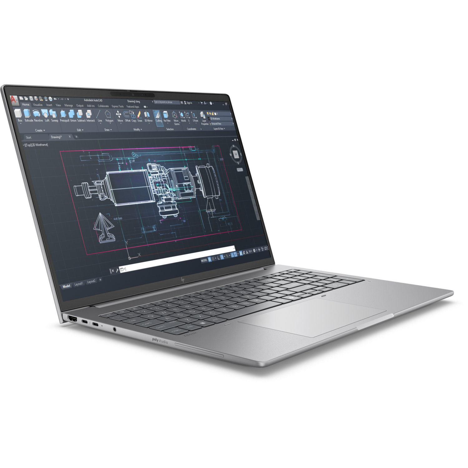 A silver laptop displays an AutoCAD drawing. The screen shows a technical diagram. The keyboard is visible, and the background is white.