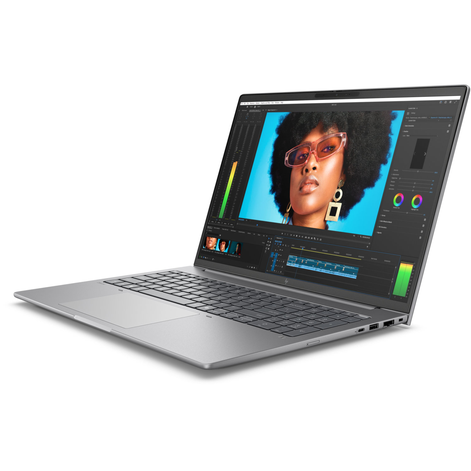 Silver laptop displaying a video editing interface. A woman with glasses is on the screen. The background is white.