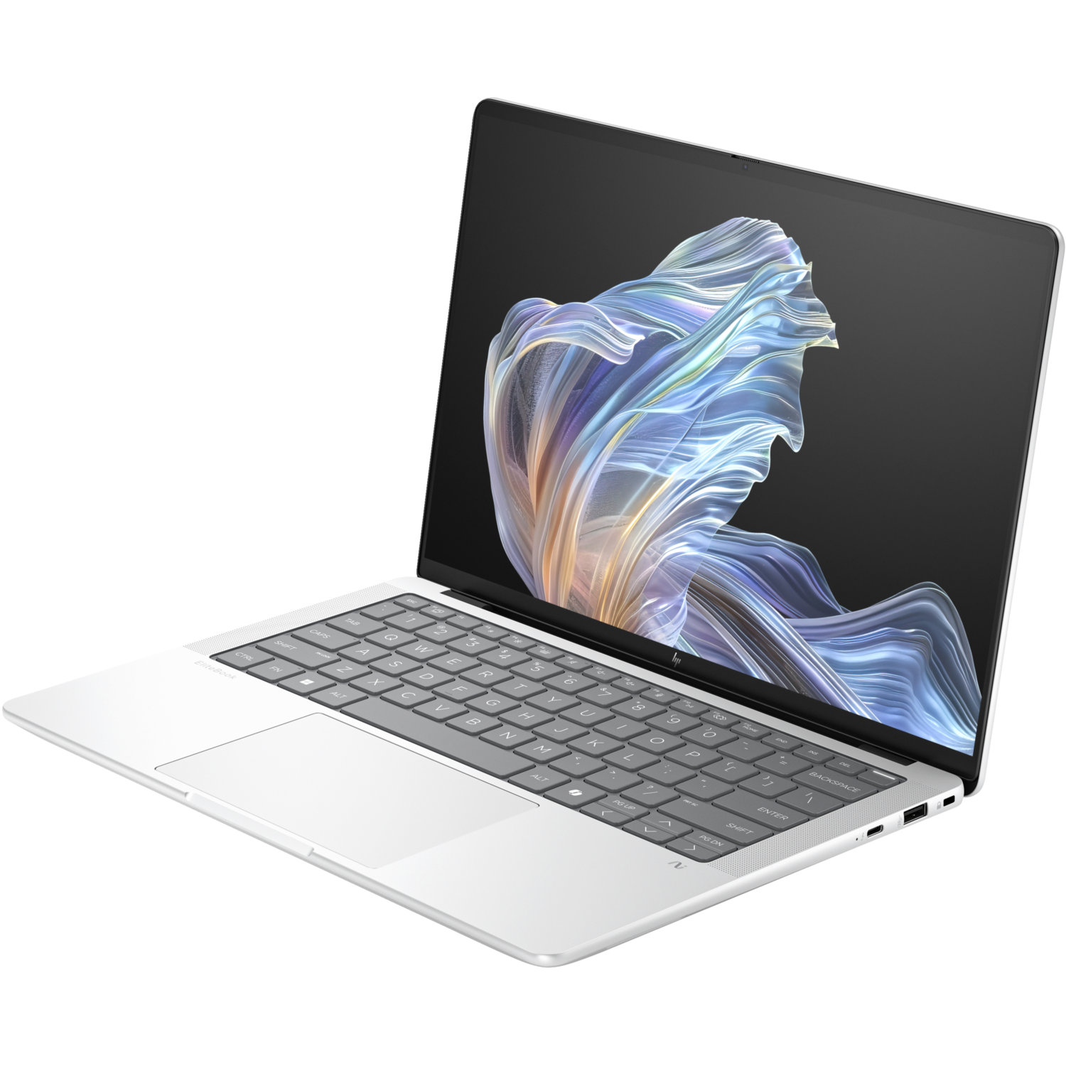 A silver laptop is open. The screen displays a colorful, abstract design. The keyboard is visible, with a touchpad on the left.