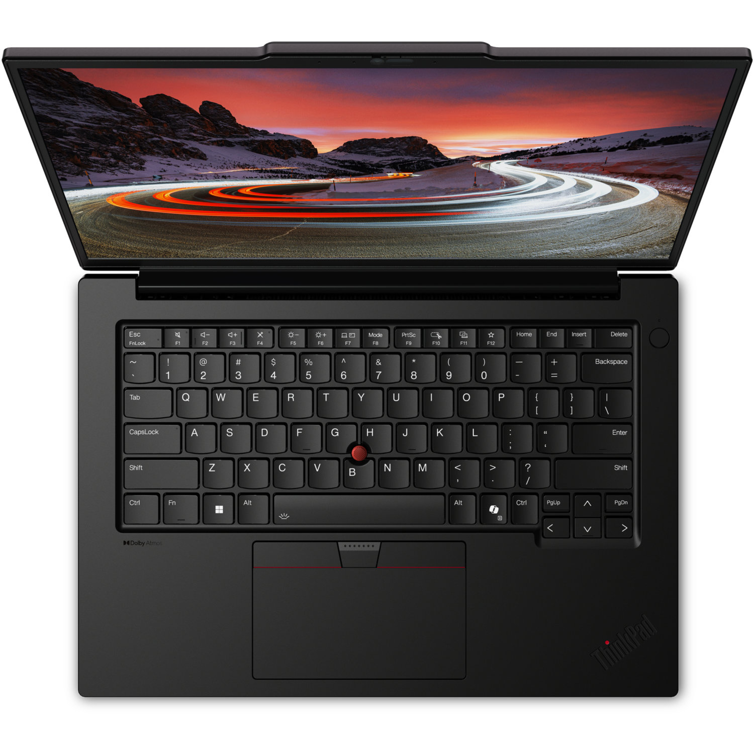 Black ThinkPad laptop open. Screen shows road with light trails. Keyboard and touchpad are visible.