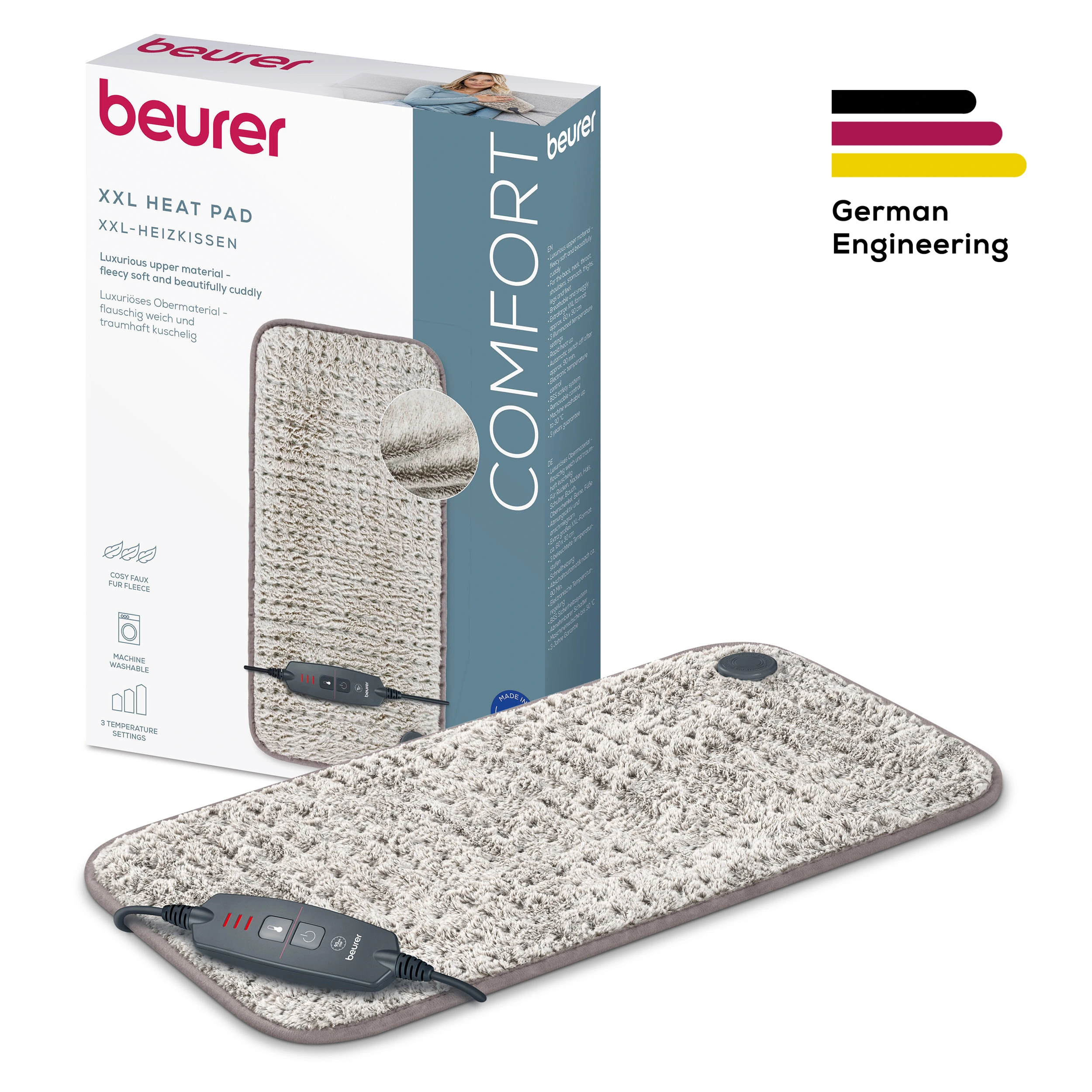 Un cuscinetto riscaldato con controllo, scatola e logo German Engineering. È di colore chiaro e soffice.
