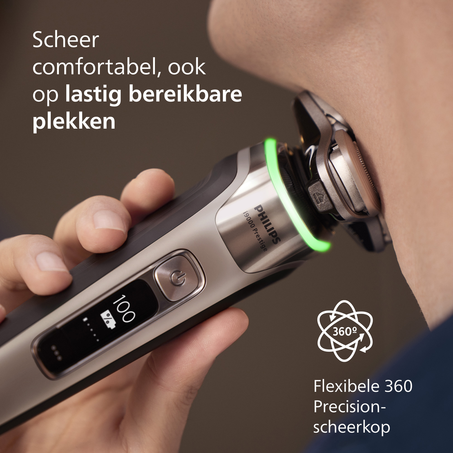A man shaves his neck with a Philips shaver. The shaver displays 100% battery. Text: Comfortable shave, even in hard-to-reach areas.