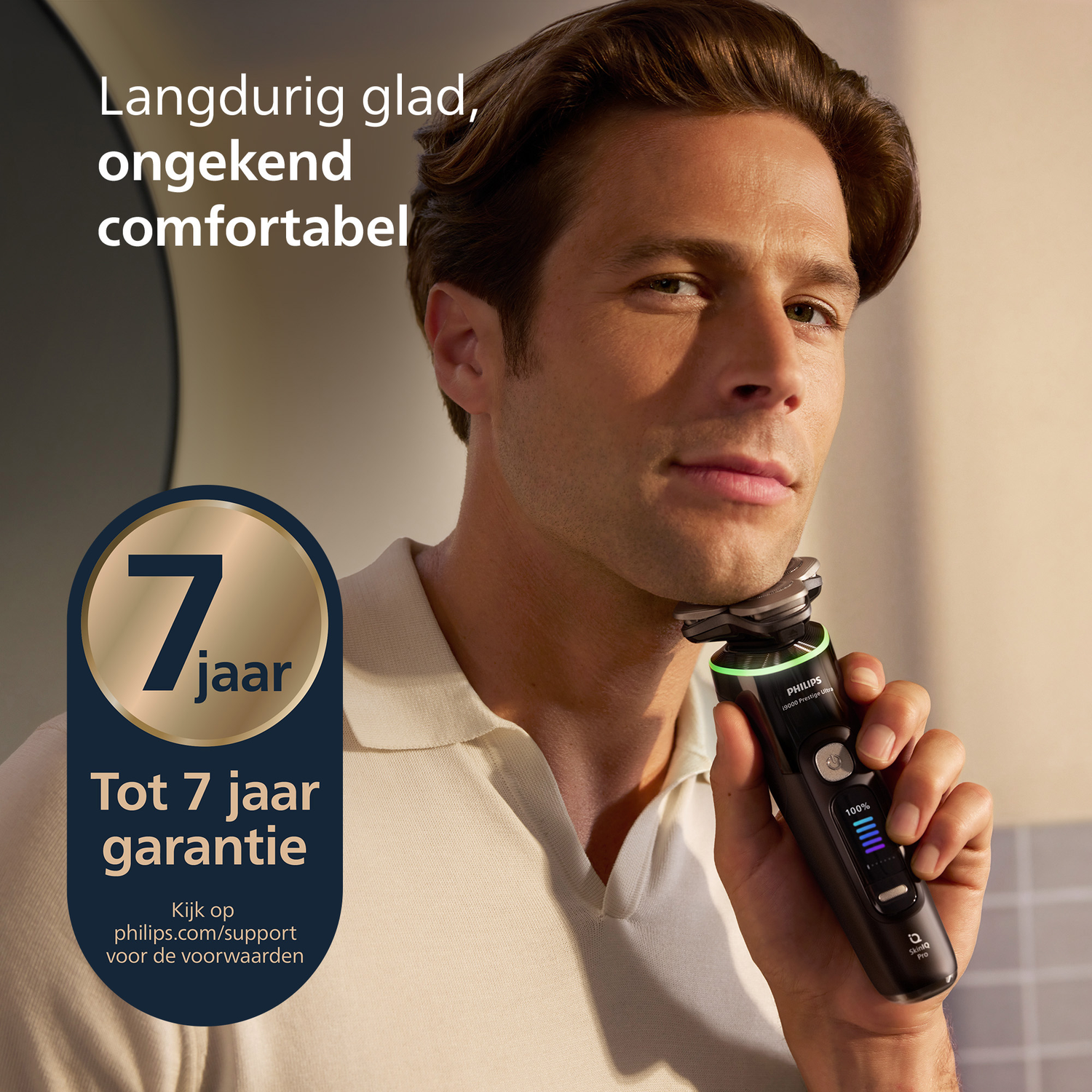 A man shaves with a Philips electric shaver. Text on the image includes "7 jaar garantie" and "Philips 19000 Prestige Ultra."