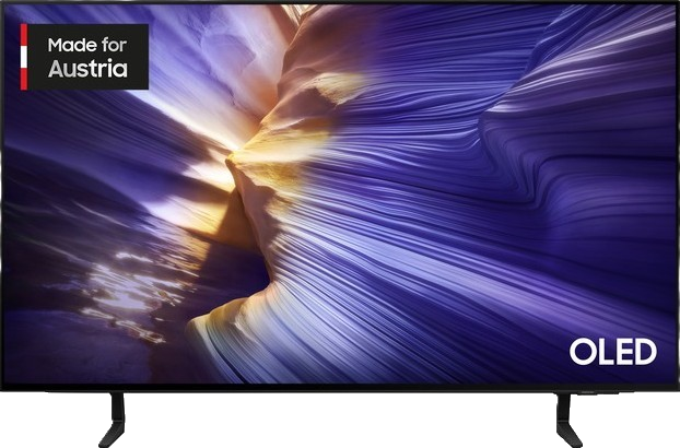 OLED-Fernseher mit farbenfrohem, abstraktem Hintergrund. Der Fernseher hat einen schwarzen Rahmen und zeigt ein wellenförmiges Muster.