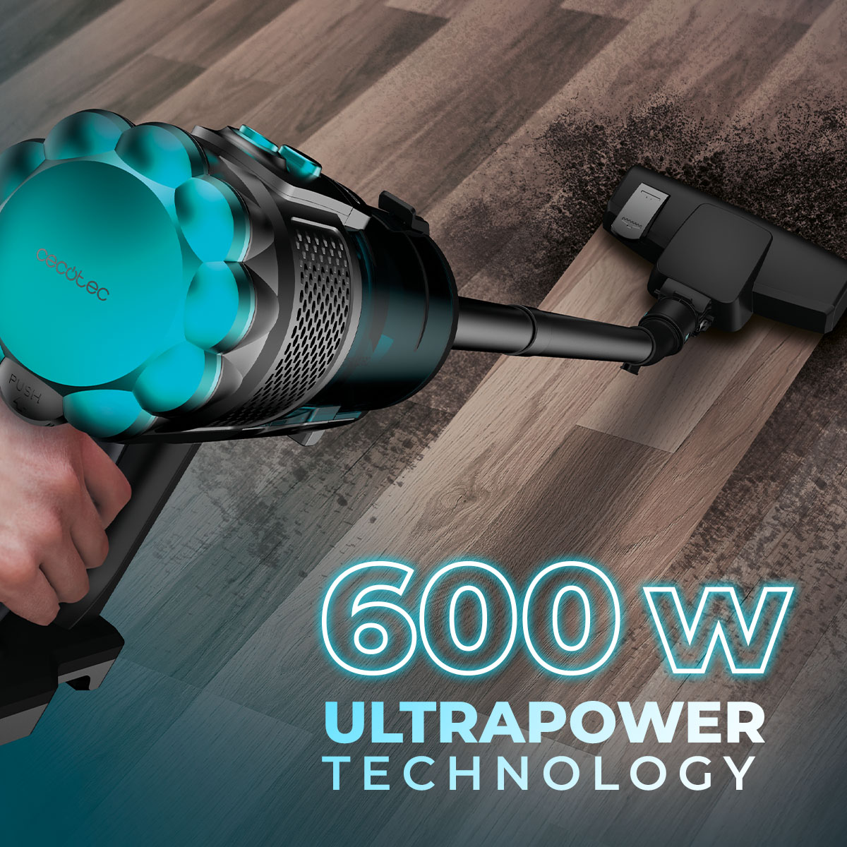 Una aspiradora de mano con diseño azul y negro se muestra en un suelo de madera, con el texto '600W ULTRAPOWER TECHNOLOGY'.