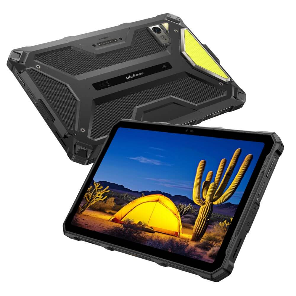 Egy strapabíró tablet, amelynek képernyője egy sivatagi jelenetet mutat kaktusszal és sátorral. A tablet fekete és szürke.