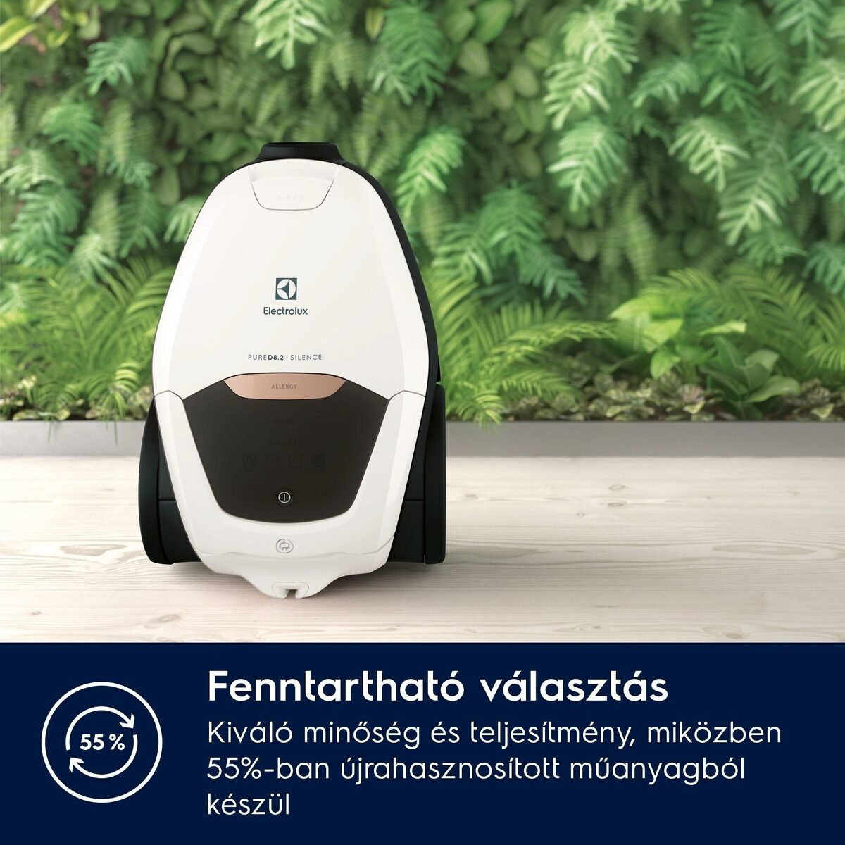 Fehér-fekete Electrolux porszívó fa felületen, zöld növény háttérrel. Alul a szöveg: fenntartható választás.