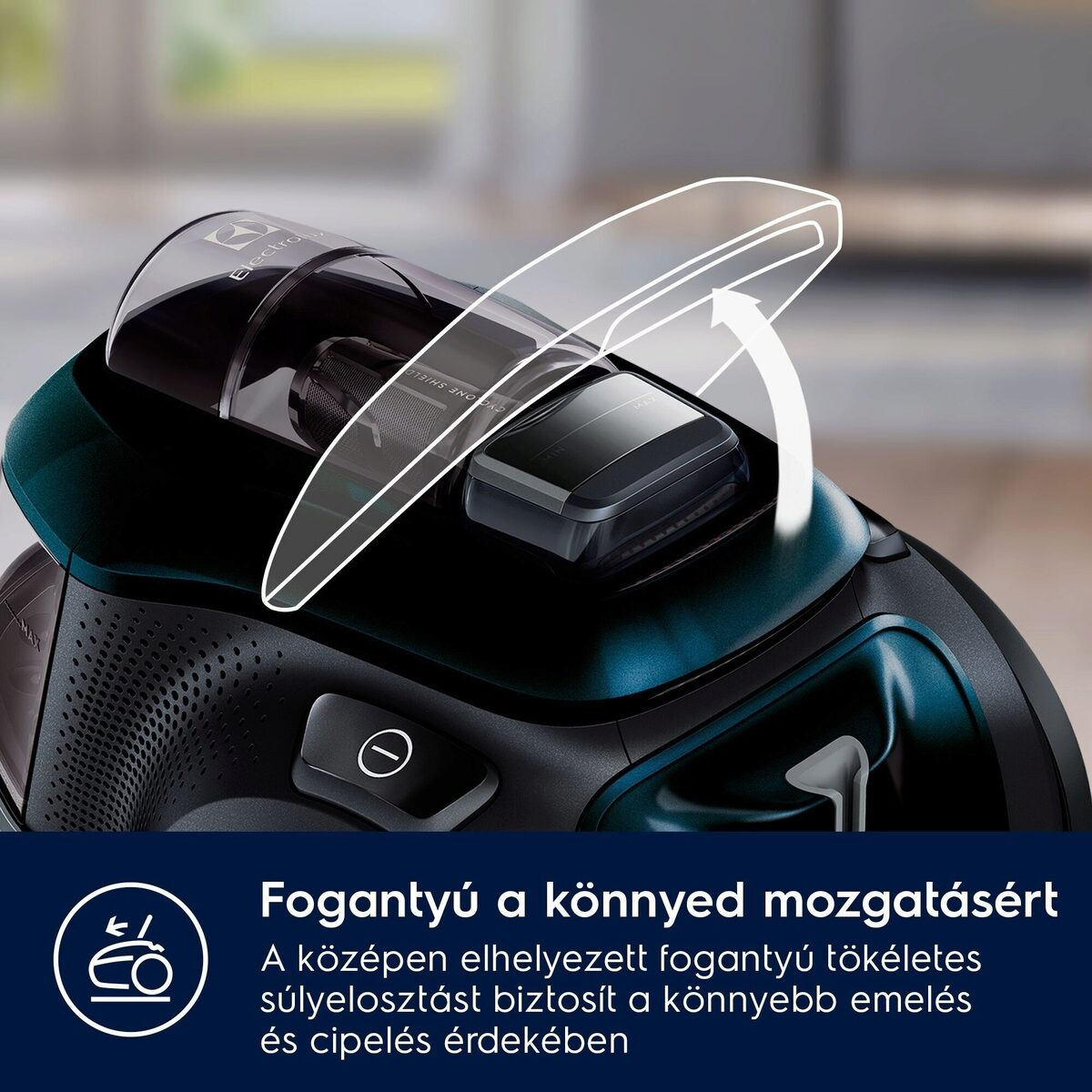 Közelkép egy fekete-türkiz porszívóról, fehér nyíllal, amely a könnyű mozgást segítő fogantyút jelzi.