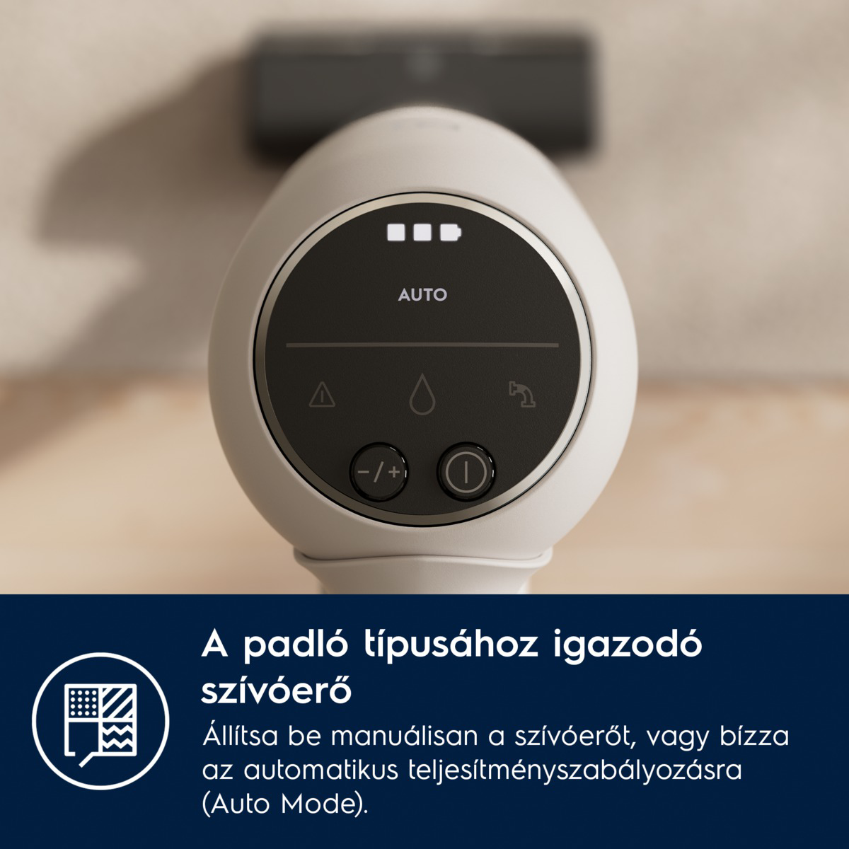 Egy fehér készülék kerek kijelzővel, ikonokkal és vezérlőkkel. Az alábbi szöveg olvasható: 'Állítsa be a szívóerőt manuálisan vagy használja az Automatikus módot.'