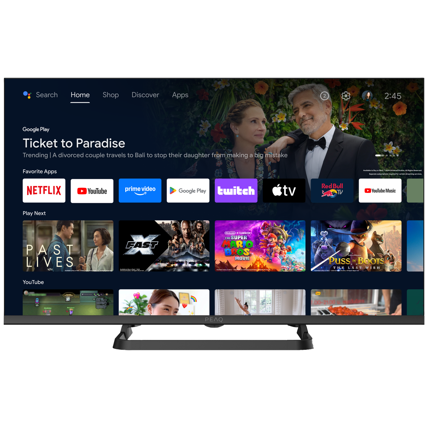 Un écran de télévision affiche l'interface Google Play. En vedette : le film Ticket to Paradise. Applications : Netflix, YouTube, Prime Video et Twitch.