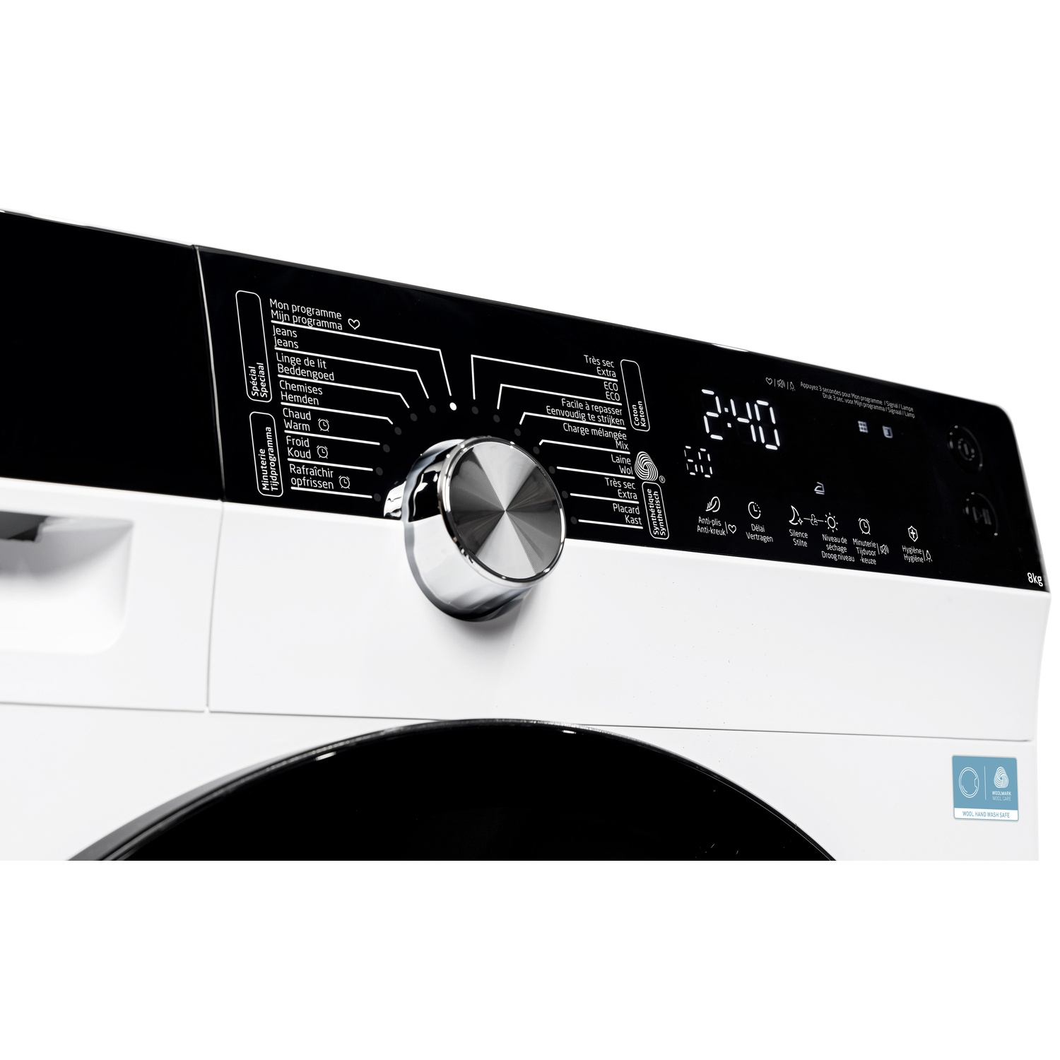 Close-up of a white washing machine control panel with a dial, digital display, and various program options.