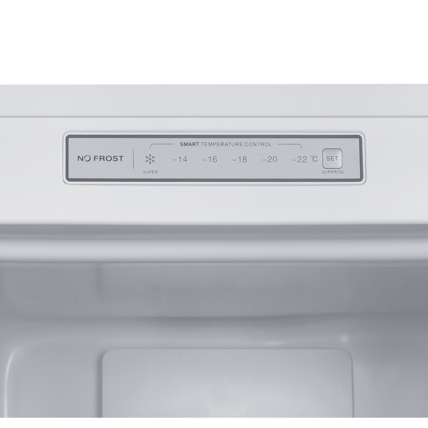 À l'intérieur d'un congélateur, panneau de contrôle avec 'No Frost', réglages de température et bouton 'Set'. Le fond est l'intérieur blanc du congélateur.