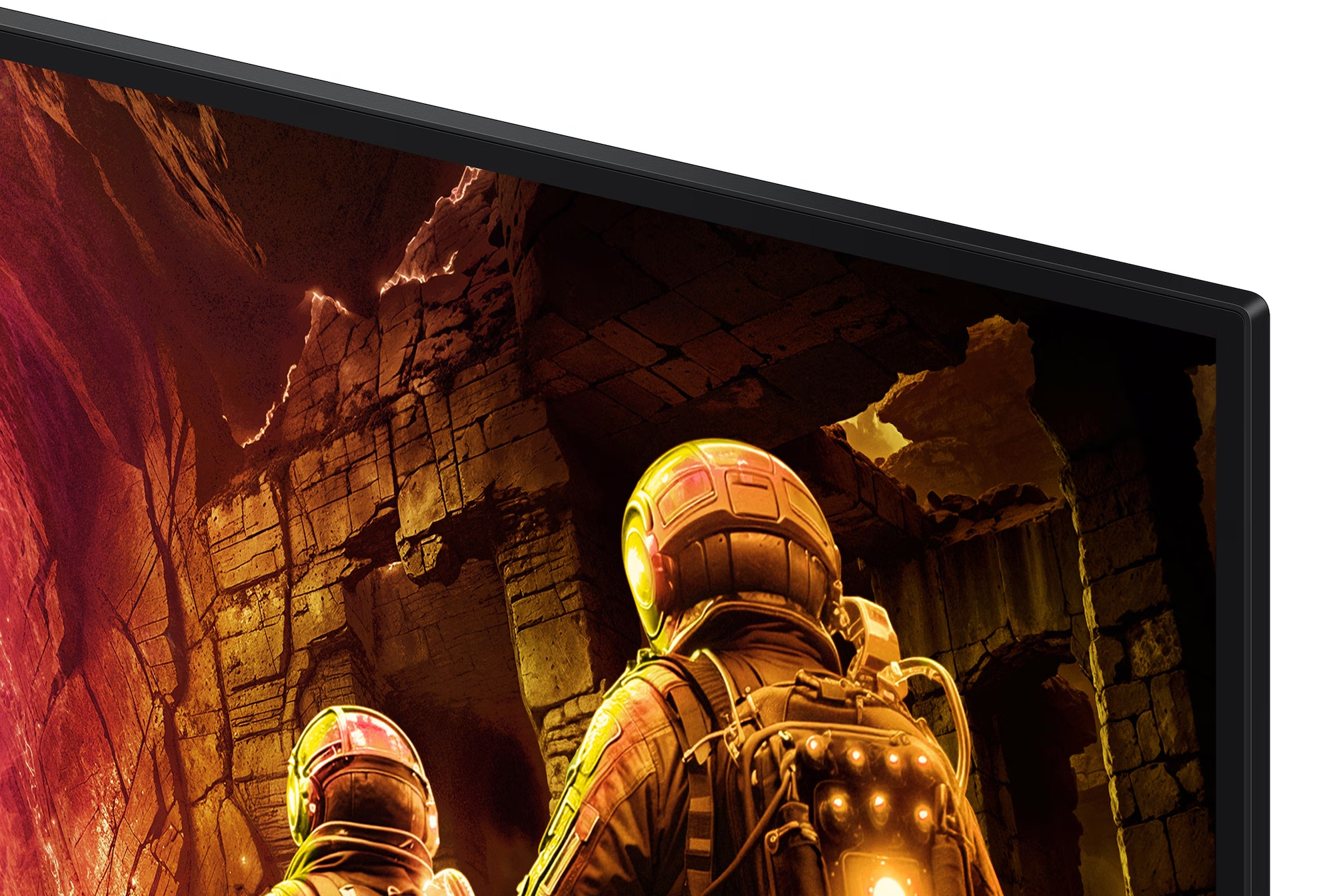 Astronauci eksplorują jaskiniową, kamienną strukturę. Scena wyświetlana jest na monitorze z czarną ramką i białym tłem.