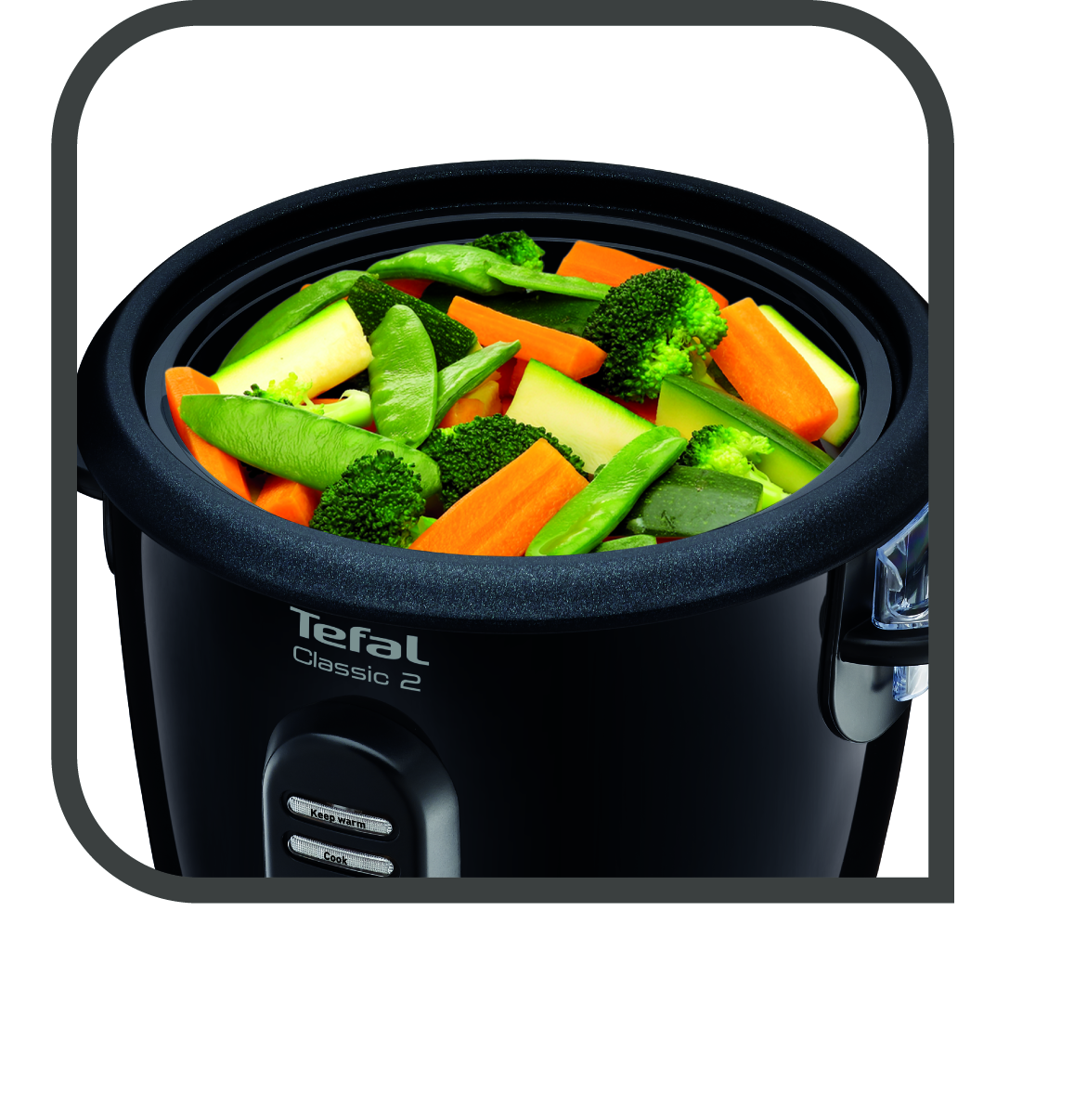 Egy fekete Tefal Classic 2 rizsfőző, tele vegyes zöldségekkel: brokkoli, sárgarépa, cukkini és zöldborsó.