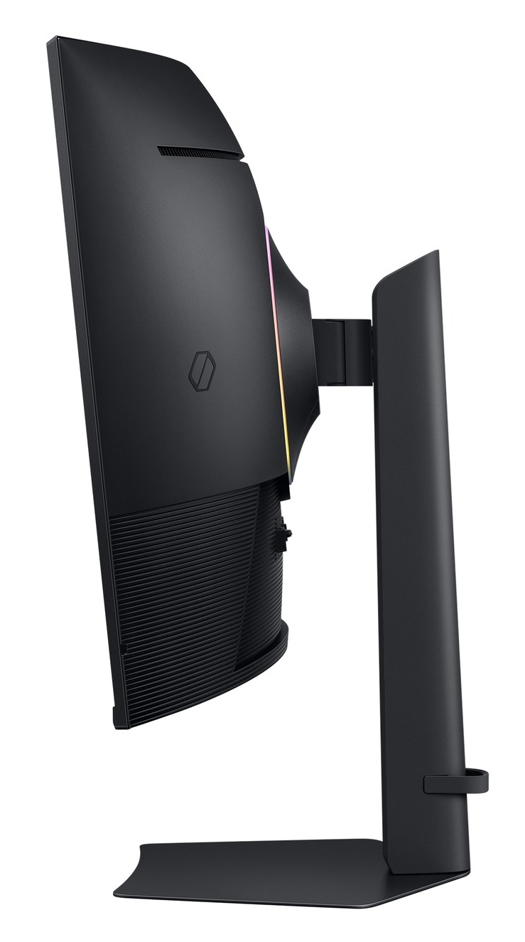 Widok z boku czarnego monitora. Ma zakrzywiony ekran, podstawę i tęczowy akcent świetlny.