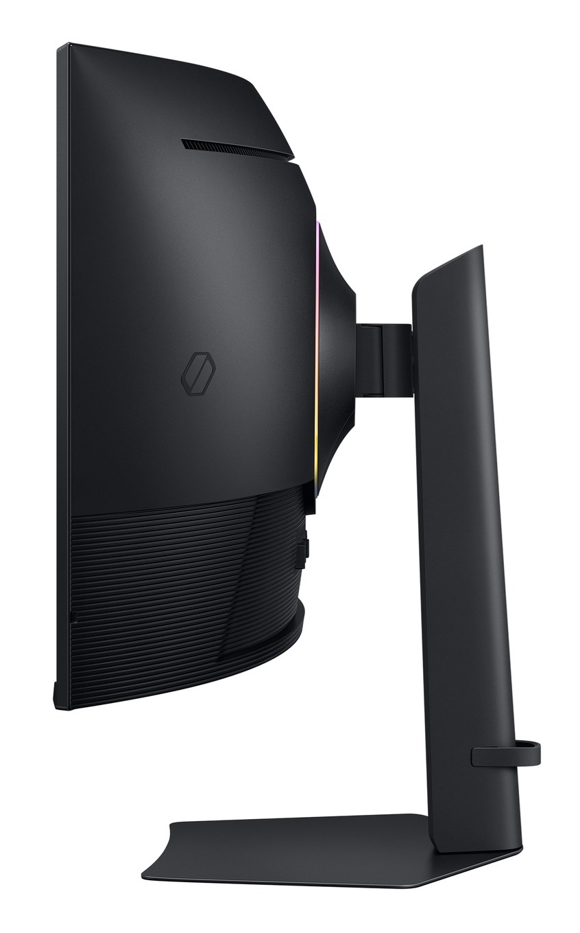 Widok z boku czarnego monitora komputerowego ze stojakiem. Ma zakrzywiony ekran i kolorowe światła.