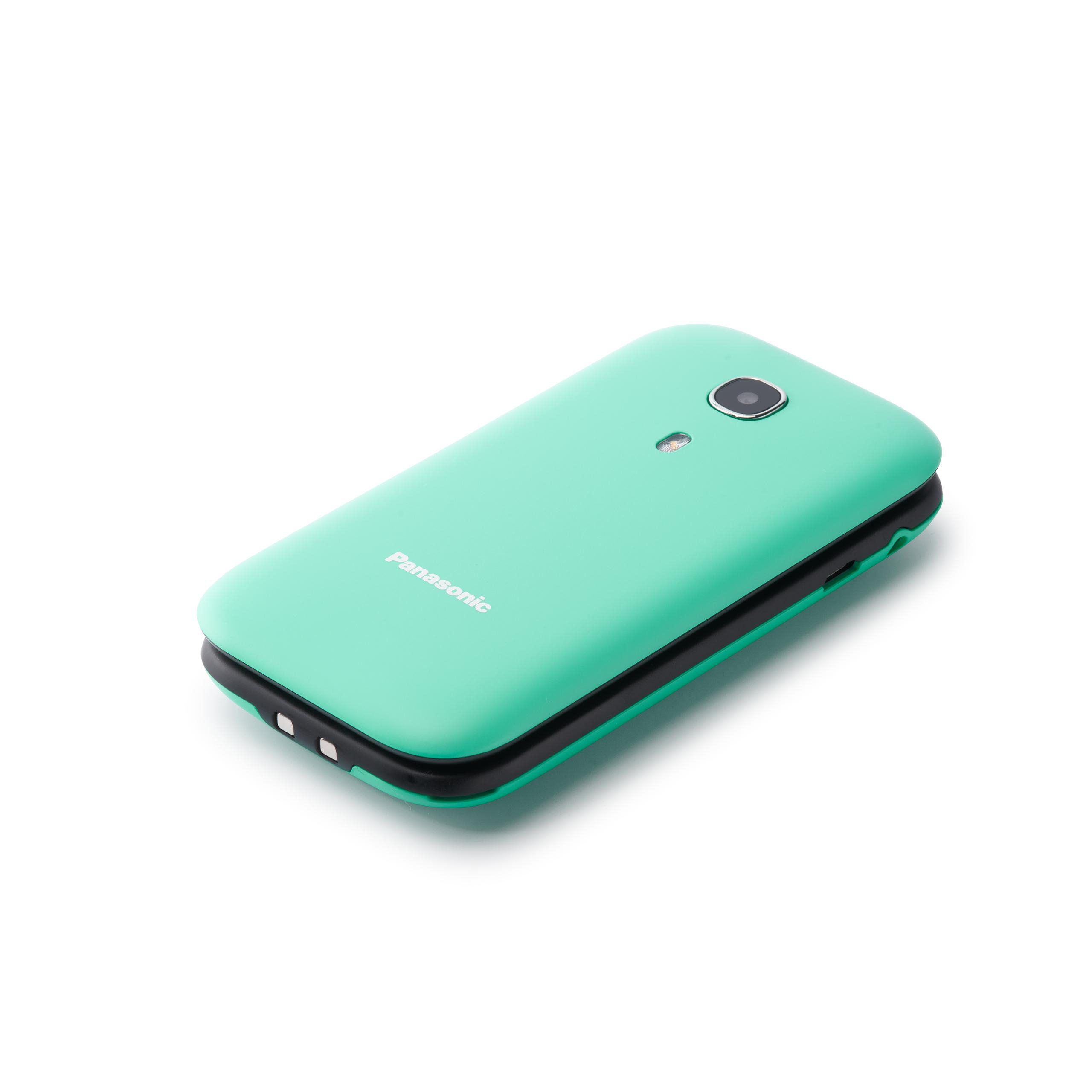 Ein türkisfarbenes Panasonic-Klapphandy liegt auf einer weißen Oberfläche. Das Telefon hat eine Kamera und einen Blitz. Der Hintergrund ist weiß.