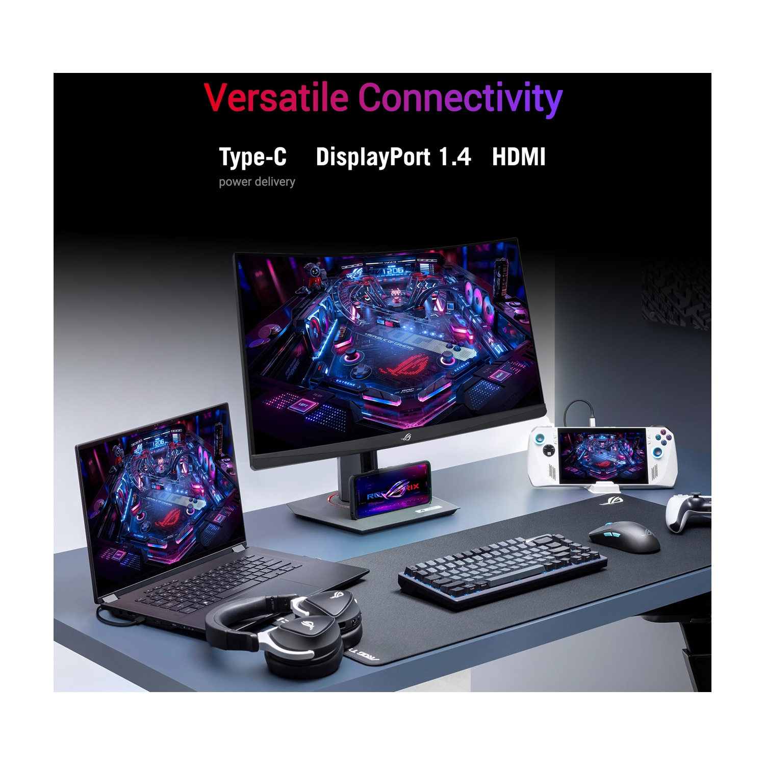 Una scrivania mostra un laptop, un monitor, una console portatile, una tastiera e un mouse. Lo schermo del monitor mostra un gioco colorato.