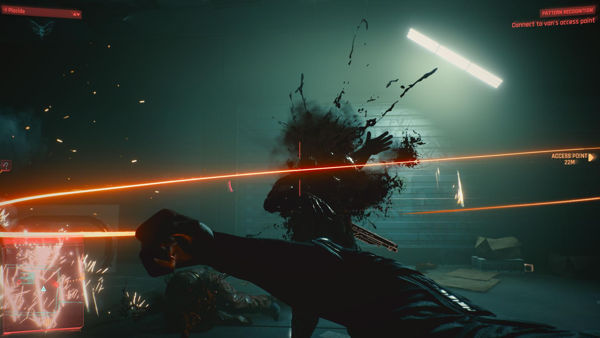 Futurystyczna scena z postacią eksplodującą w czarnej, przypominającej krew materii. Widoczne są jasne pomarańczowe linie i interfejs cyfrowy.