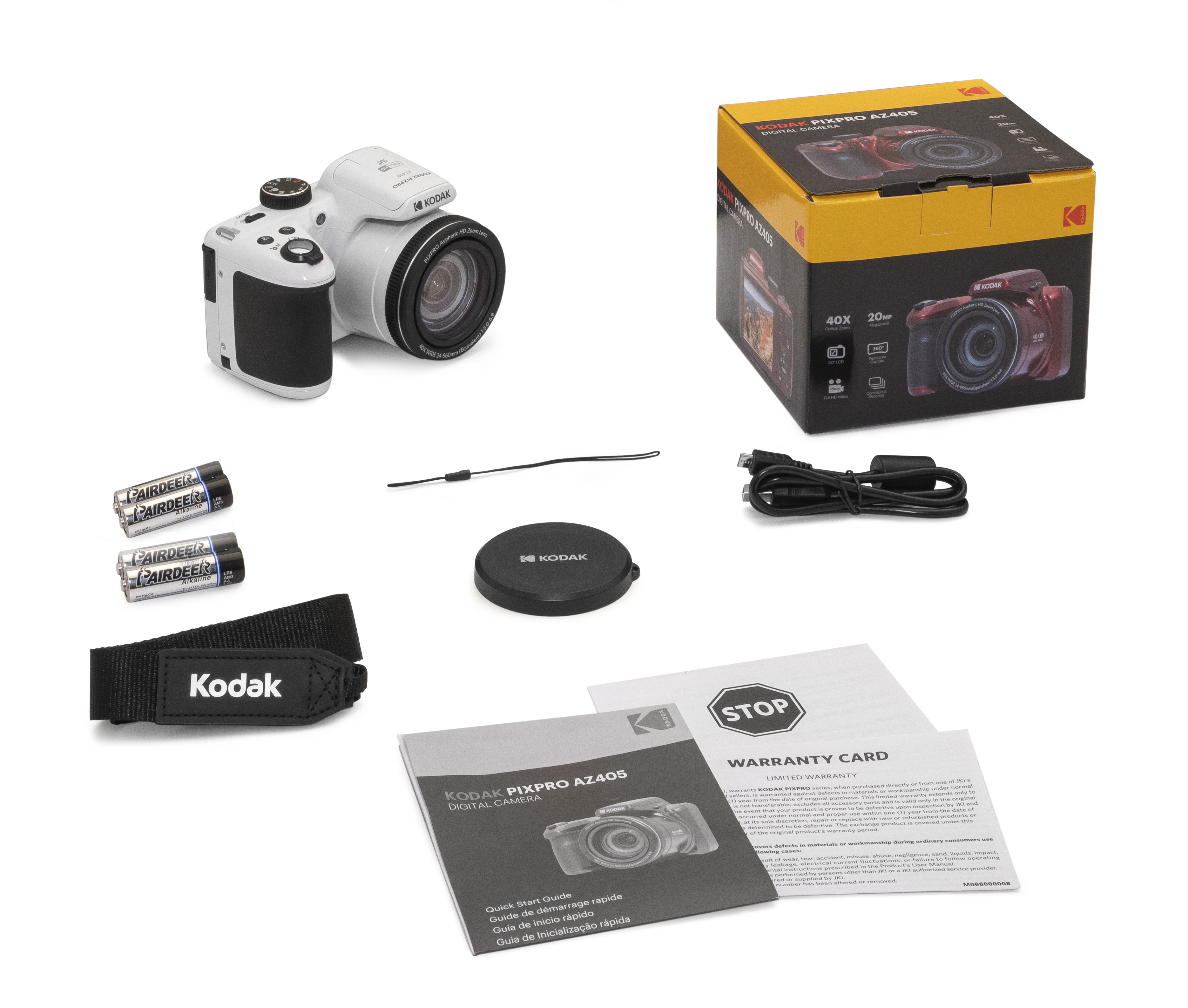 Beyaz bir Kodak kamera, kutu, piller, kayış, lens kapağı ve kılavuzlar beyaz bir yüzeyde.