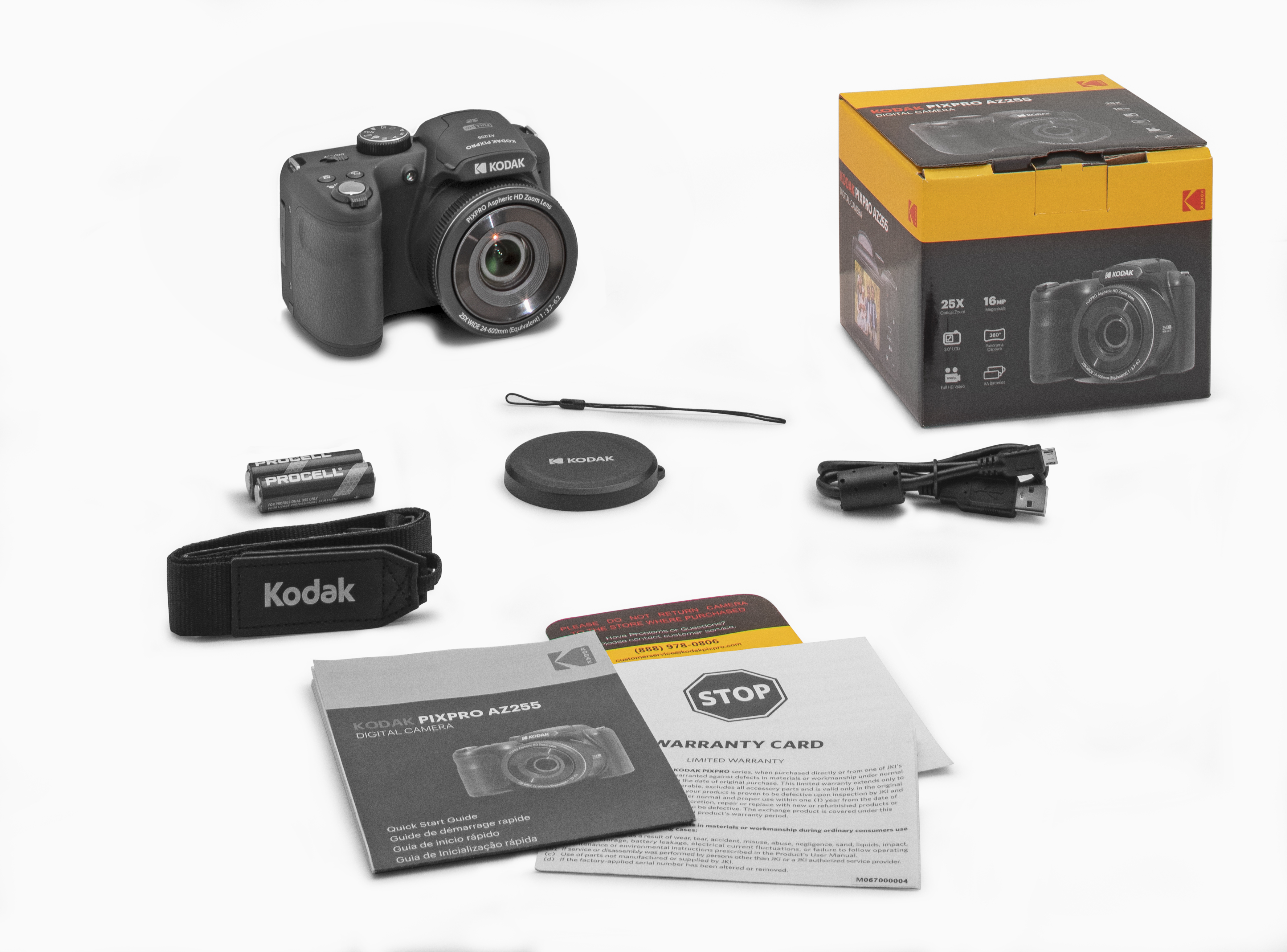 Siyah bir Kodak Pixpro AZ255 fotoğraf makinesi ve aksesuarları beyaz bir yüzeyde. Kutu, pil ve kayış içerir.
