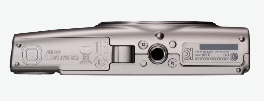 Srebrna podstawa kamery z tekstem, śrubami i szczegółami portu. Zawiera gniazdo baterii, oznaczenia i etykietę Canon.