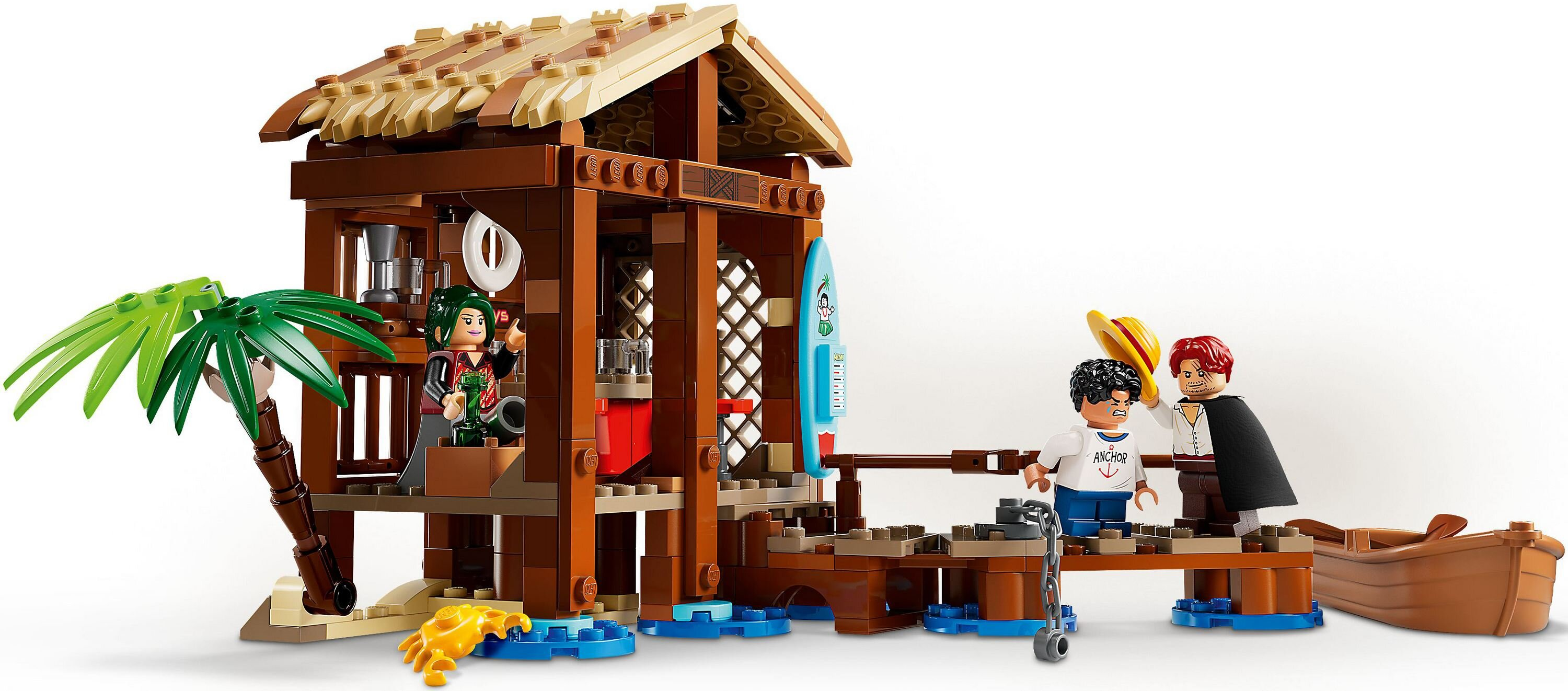 Zestaw Lego z drewnianą chatą, palmą i figurkami. Figurki obejmują kobietę, chłopca i mężczyznę trzymającego kapelusz w pobliżu łodzi.