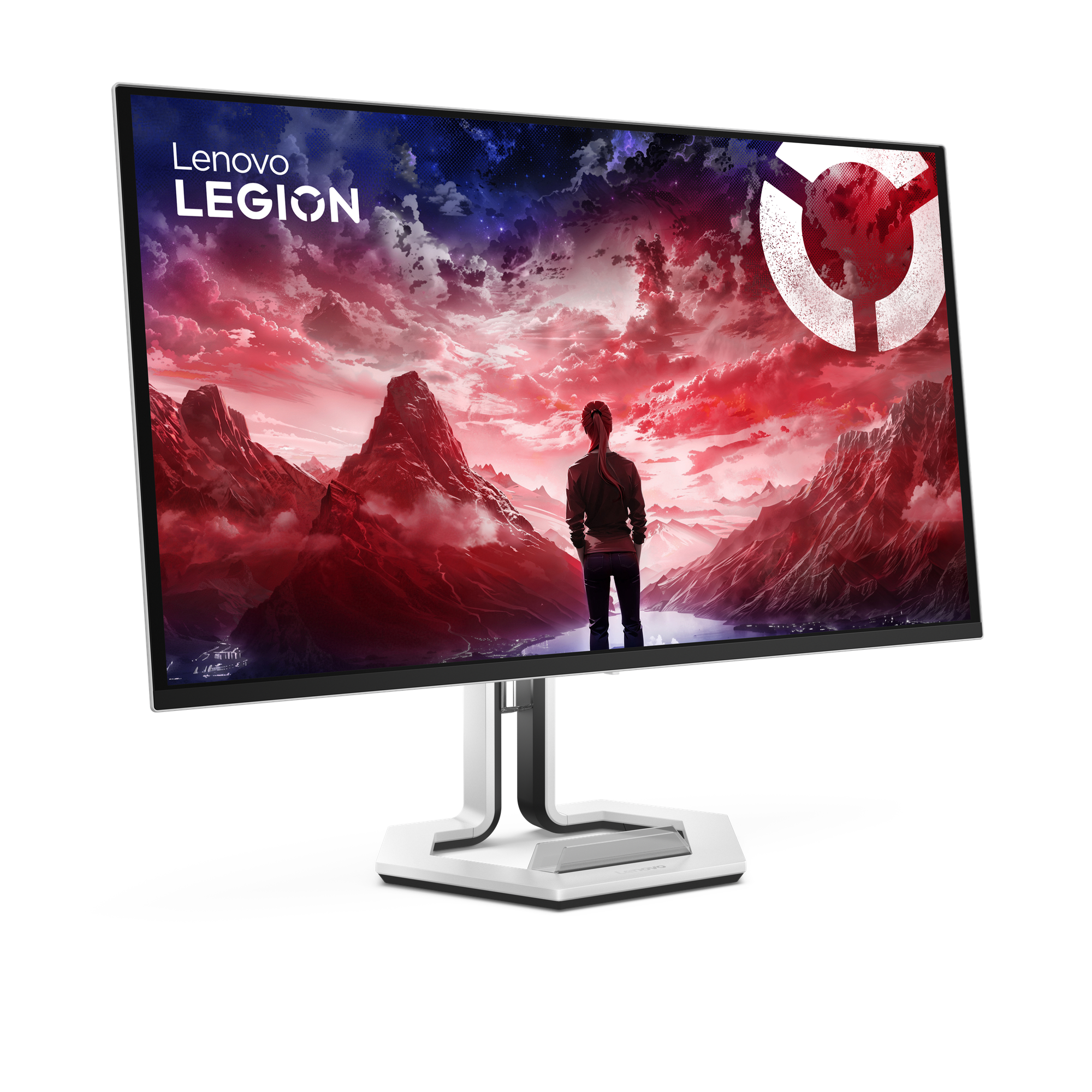 Monitor Lenovo Legion. Osoba stoi przed czerwonym górskim krajobrazem. Białe logo w prawym górnym rogu.