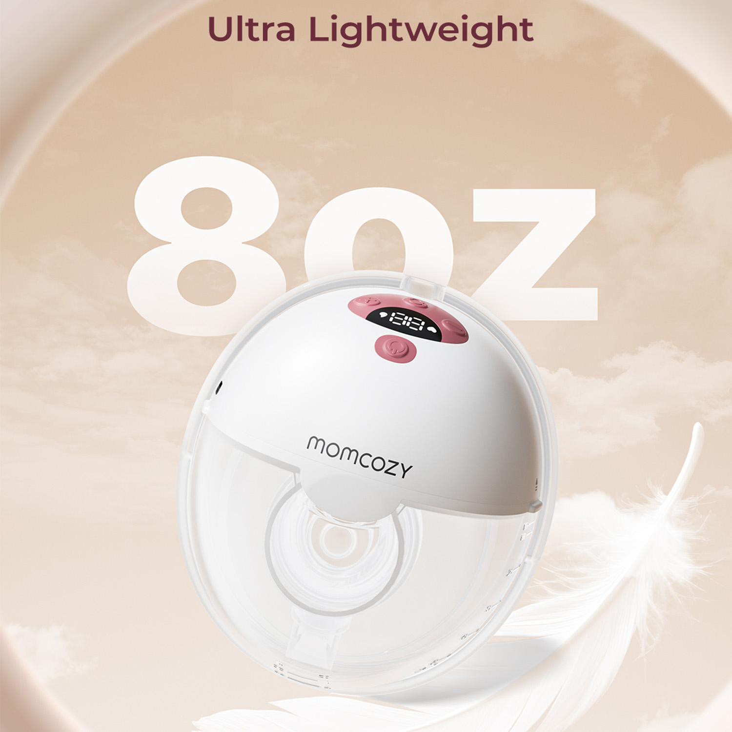 Eine weiße Brustpumpe mit rosa Display, der Markenname momcozy und der Text "8oz". Eine Feder ist im Hintergrund.