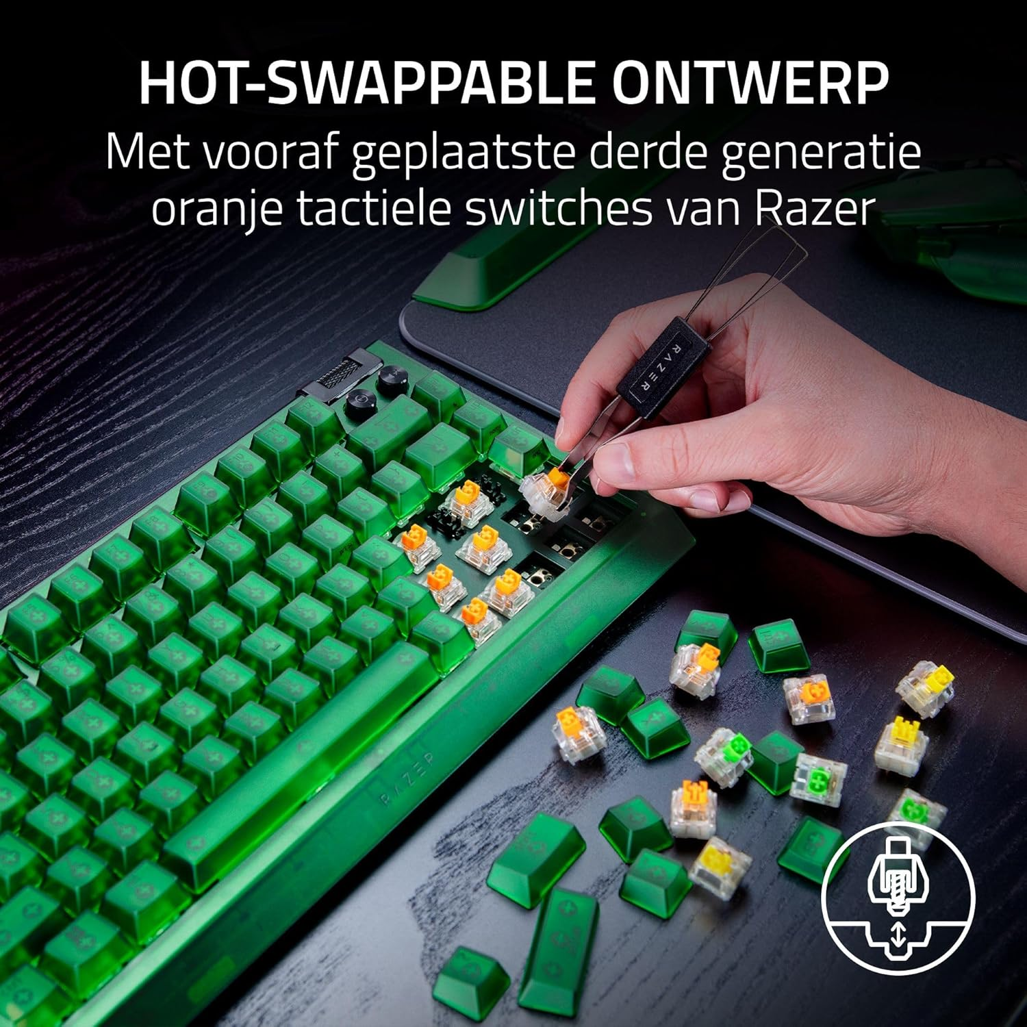 A green Razer keyboard with orange tactile switches. A hand is removing a switch. Green keycaps and switches are scattered around.