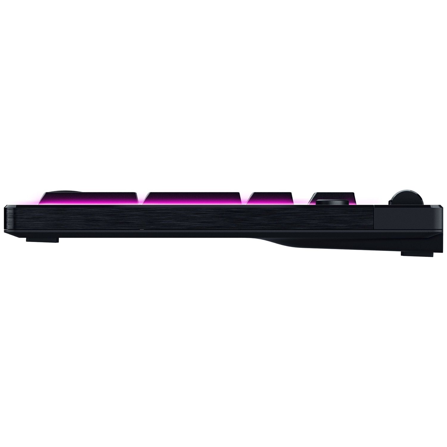Side view of a black keyboard with pink backlighting. The keyboard is on a white background. Some keys are visible.