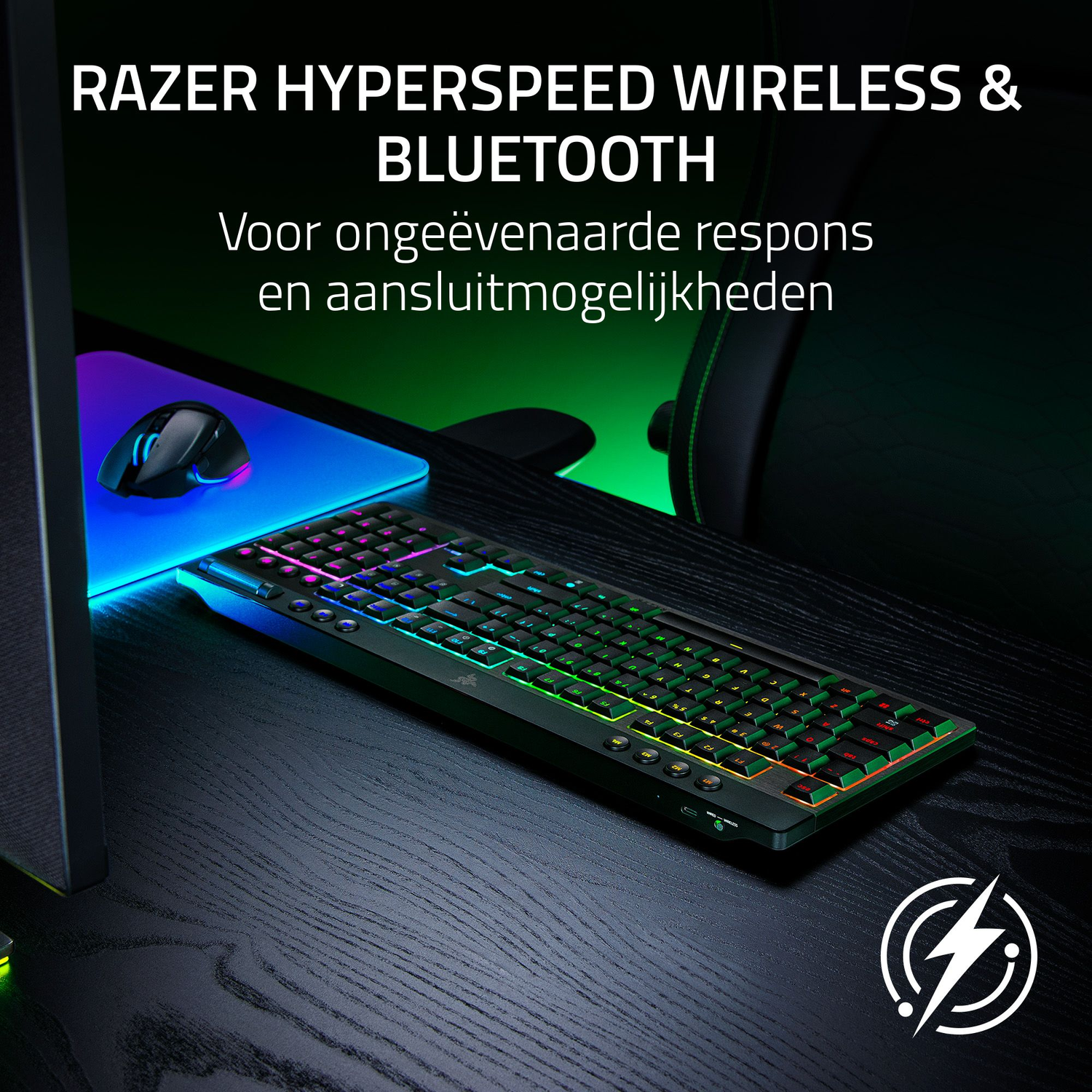 A gaming setup with a keyboard and mouse. The keyboard has colorful lights, and the mouse is on a blue mousepad.