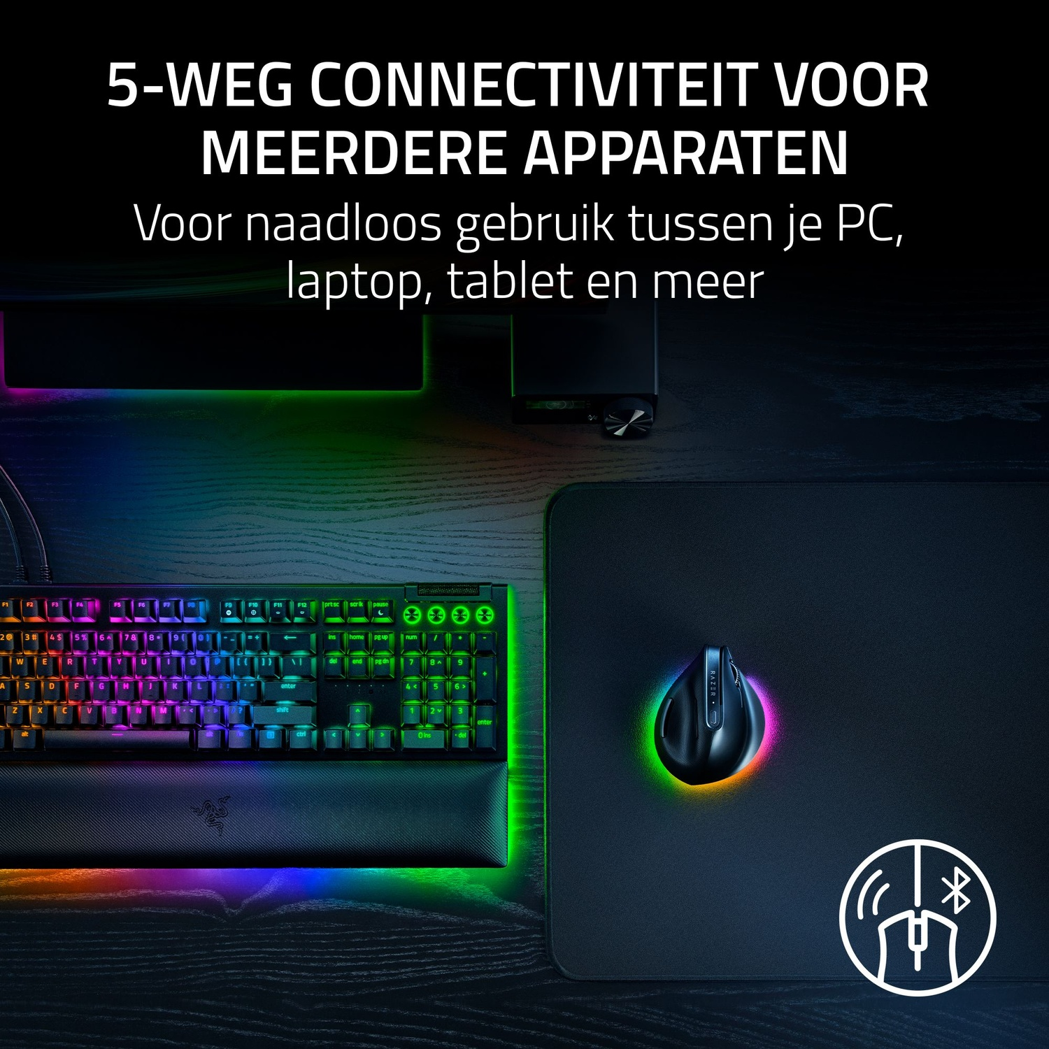 A keyboard with colorful lights, a mouse, and a mousepad are on a dark wooden surface, with text about connectivity.