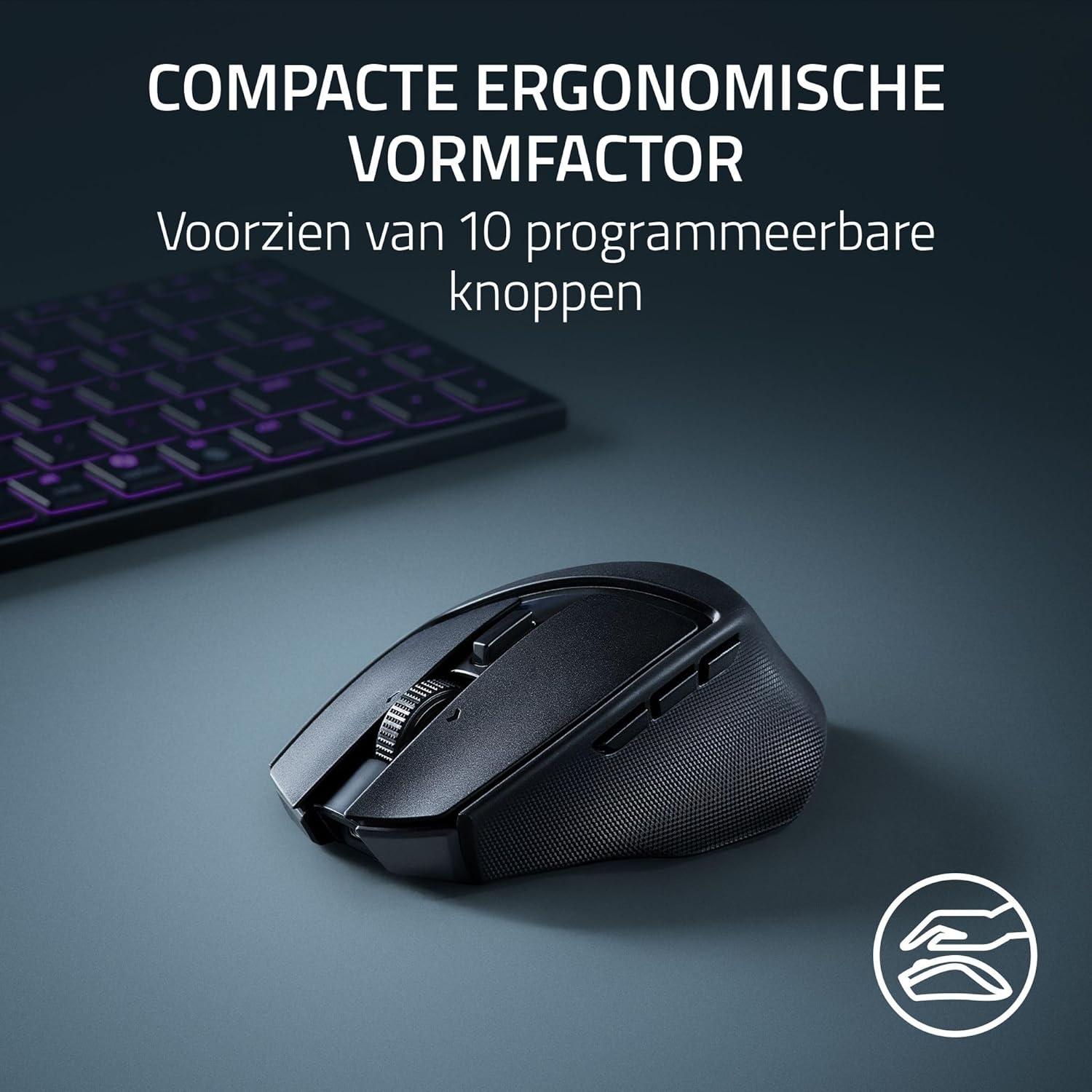 Black ergonomic mouse with scroll wheel and buttons. A keyboard is visible in the background. Text: compact ergonomic form factor.