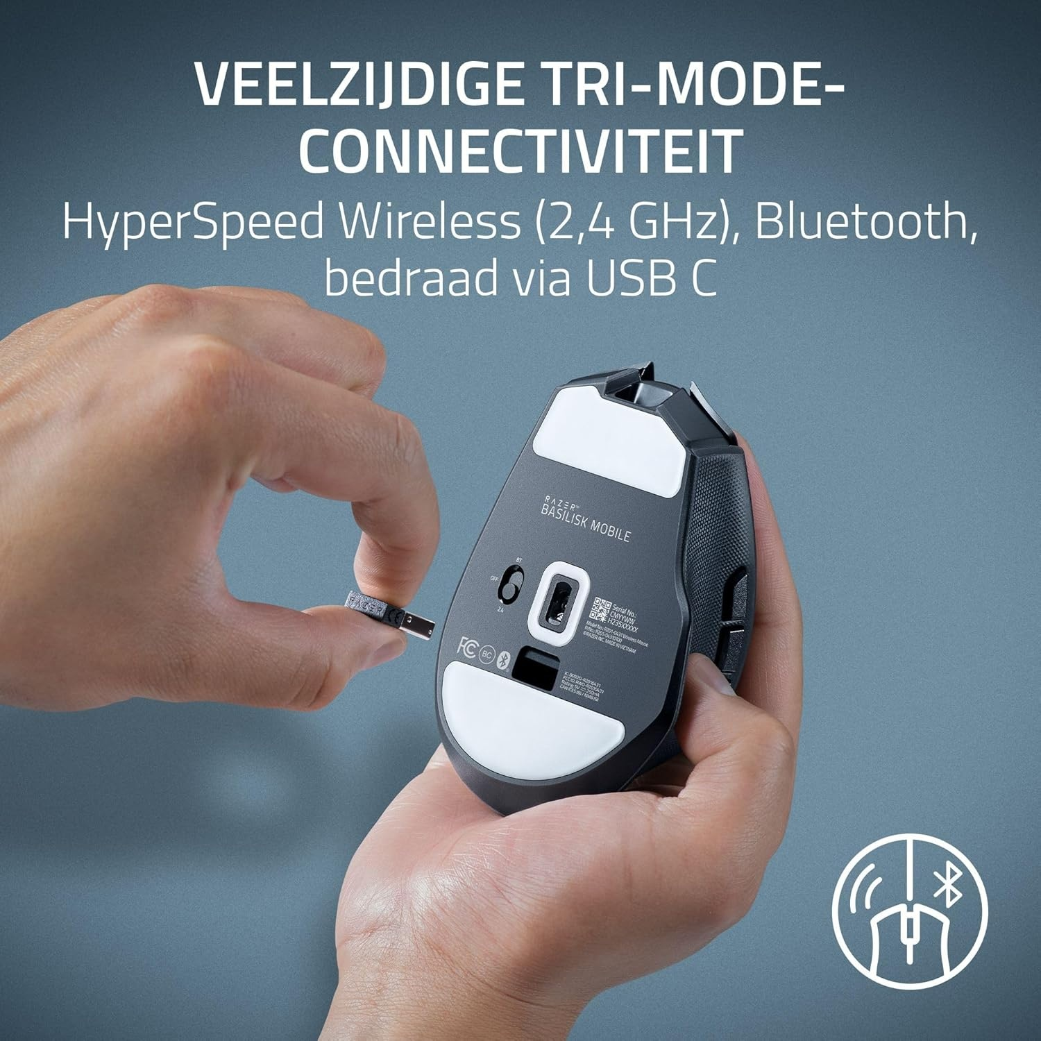 A hand holds a wireless mouse, inserting a USB receiver. Text above says 'Tri-Mode Connectivity' and connectivity options.
