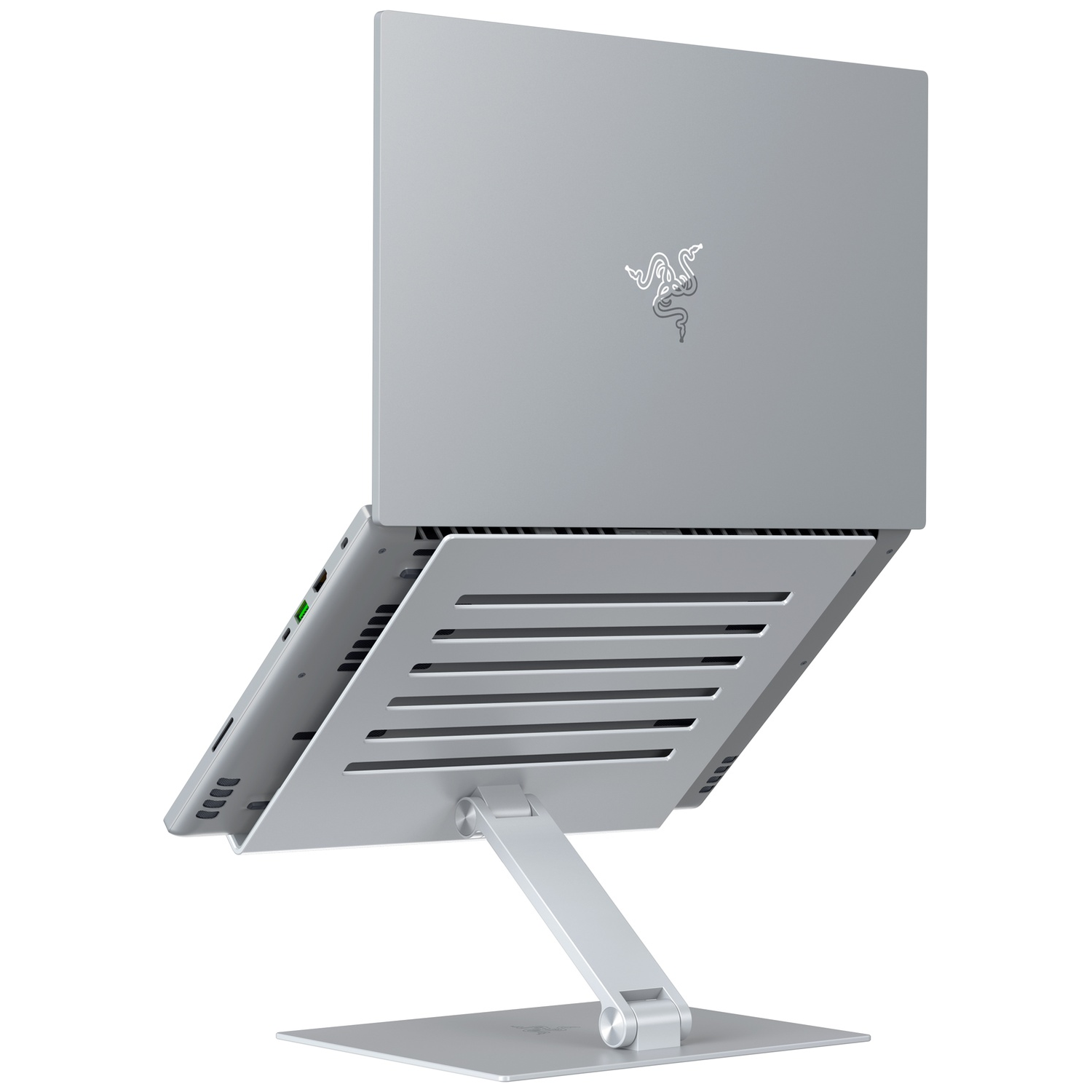 Silver laptop on a stand, angled upwards. Razer logo visible on the lid. Stand has a square base and adjustable arm.