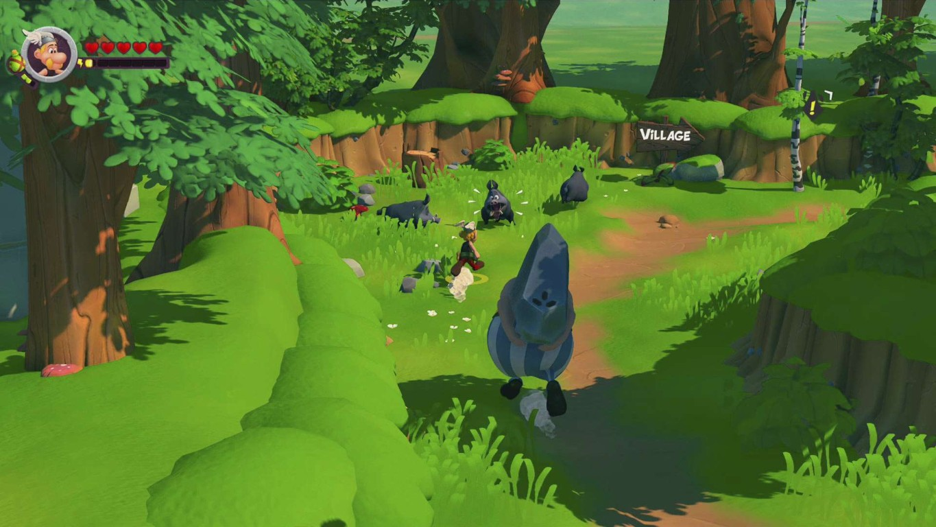 Scena z kreskówki z wioską z drzewami, postaciami i zwierzętami. Jedna postać niesie dużą skałę. Wioska jest w tle.