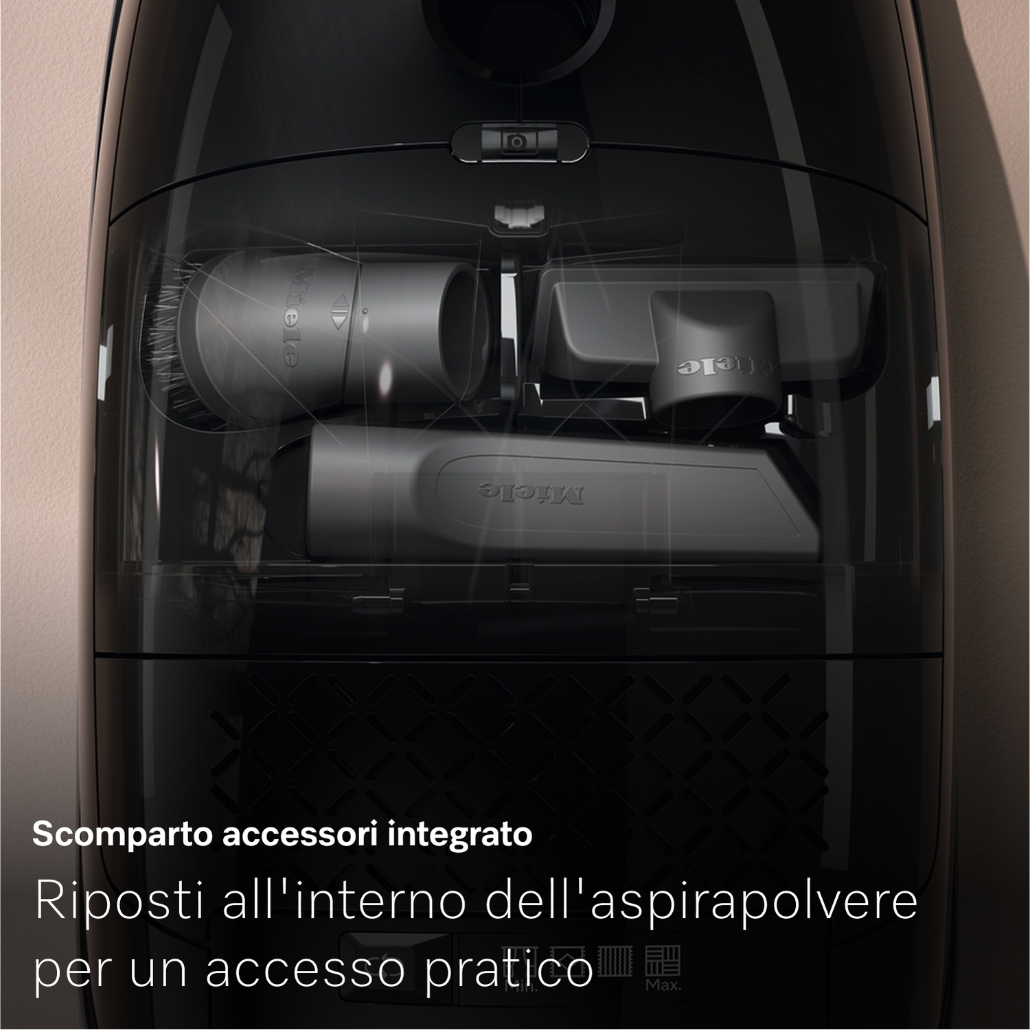Aspirapolvere nero con vano trasparente che rivela accessori. Logo Miele visibile. Testo in basso: Vano accessori integrato.