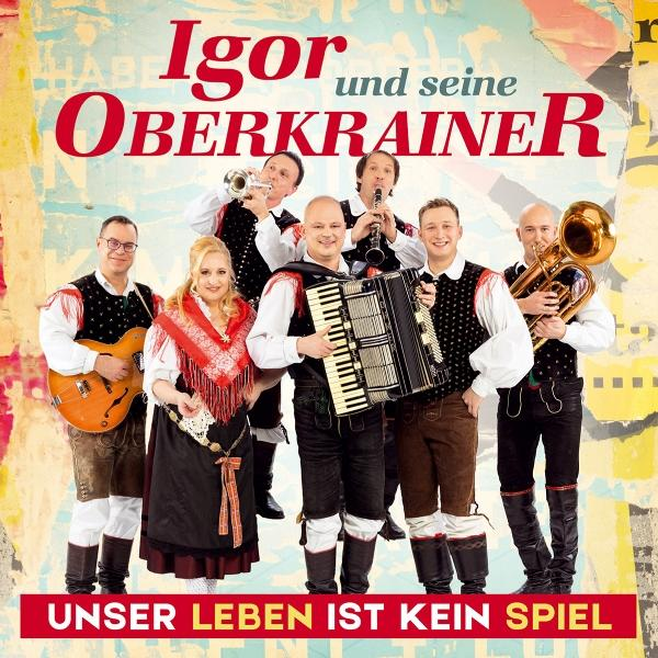 Bandfoto: Sieben Musiker in Tracht, spielen Instrumente. Oben steht "Igor und seine Oberkrainer", unten Text.