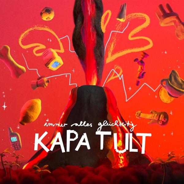 Ein stilisierter Vulkan bricht mit Lava vor rotem Hintergrund aus, verschiedene Objekte schweben herum, und das Wort KAPA TULT ist sichtbar.