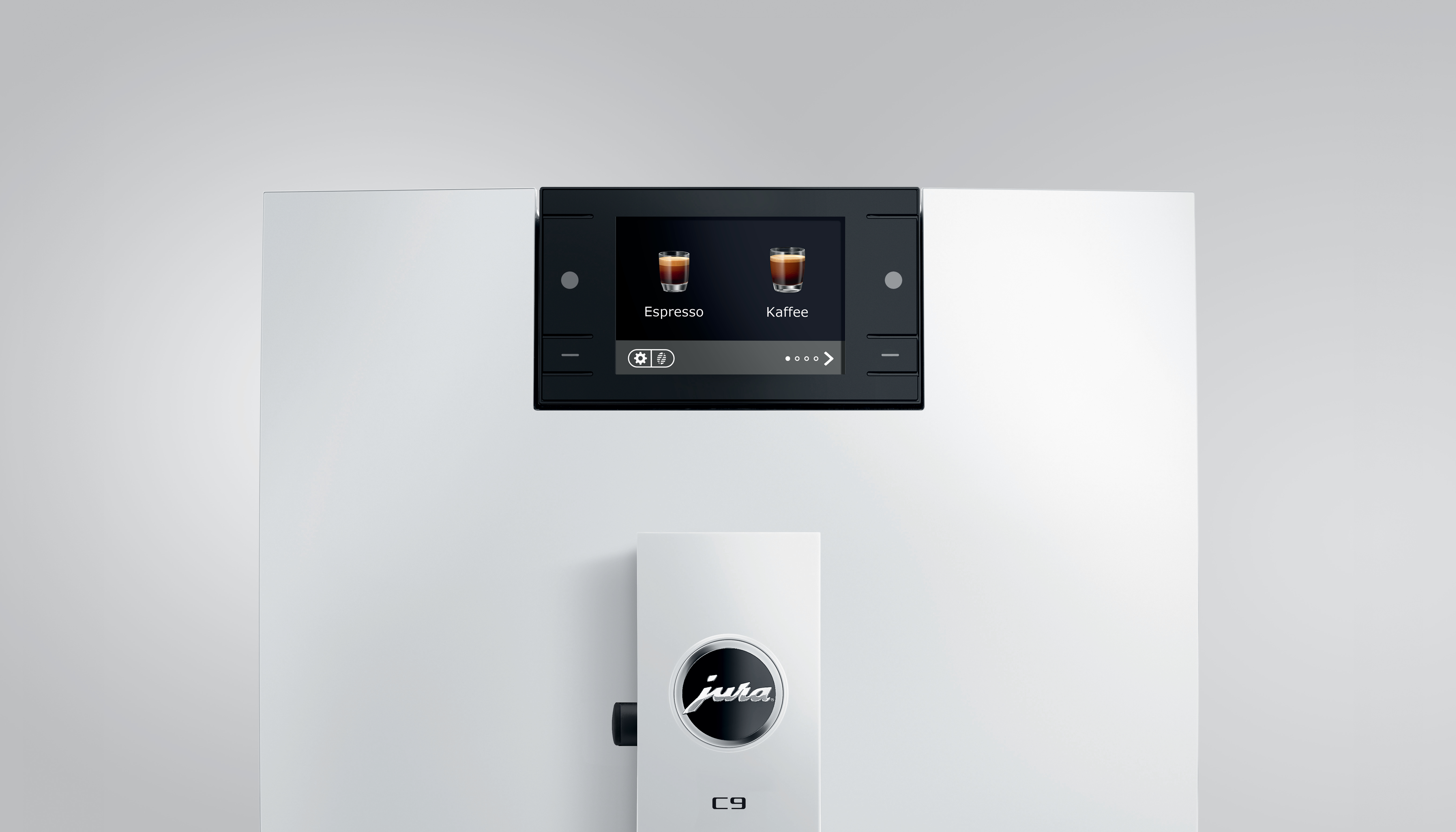 Eine weiße Kaffeemaschine mit schwarzem Display, das Espresso- und Kaffeeoptionen zeigt. Jura-Logo sichtbar.