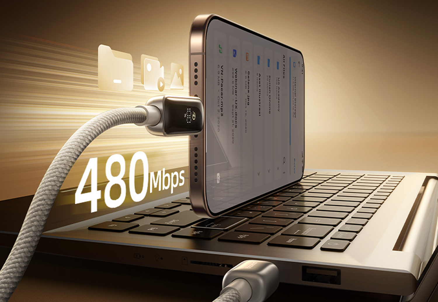 Un teléfono conectado a una computadora portátil mediante un cable. La pantalla del teléfono muestra archivos. El cable muestra la transferencia de datos a 480 Mbps.