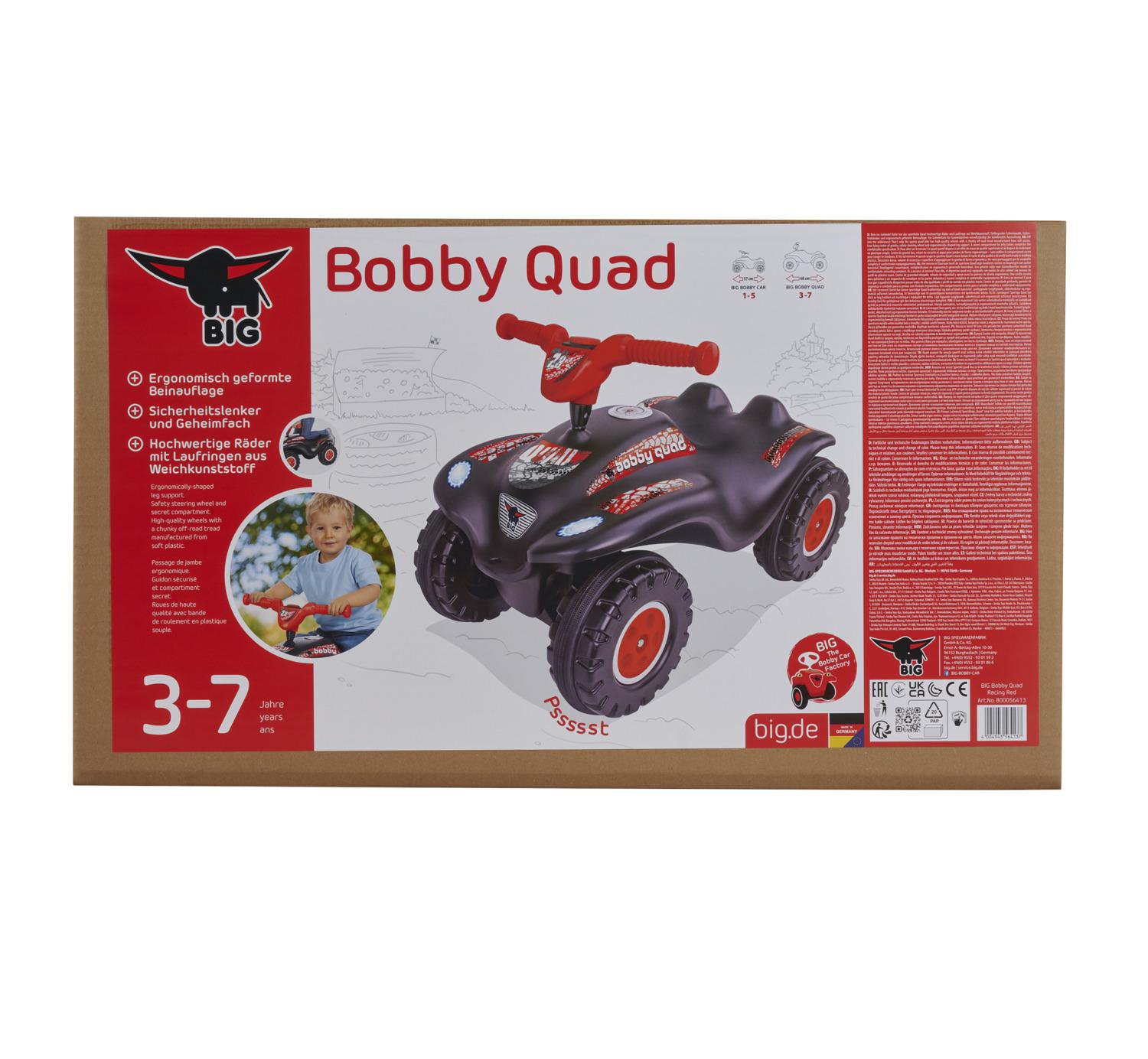 Ein schwarzes Bobby Quad-Spielzeug mit roten Rädern und Lenker. Die Box hat Text und ein Kind, das ein ähnliches Spielzeug fährt.