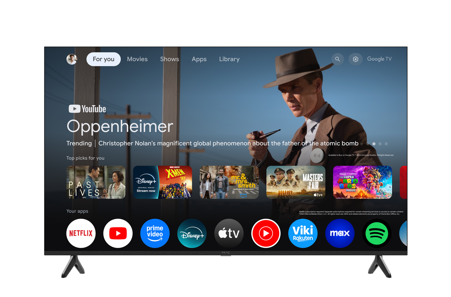 Pantalla de TV muestra interfaz Google TV, con promoción película Oppenheimer e iconos de aplicaciones como Netflix.