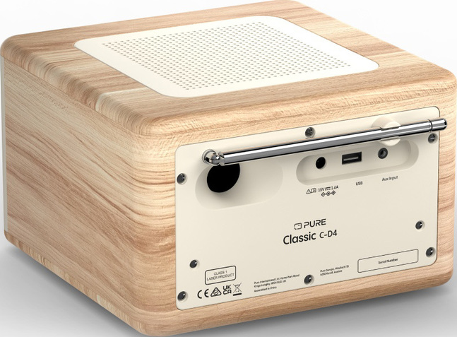 Radio en bois avec des accents blancs. Comprend un haut-parleur, une antenne et des ports d'entrée. Le panneau arrière affiche la marque et le numéro de série.