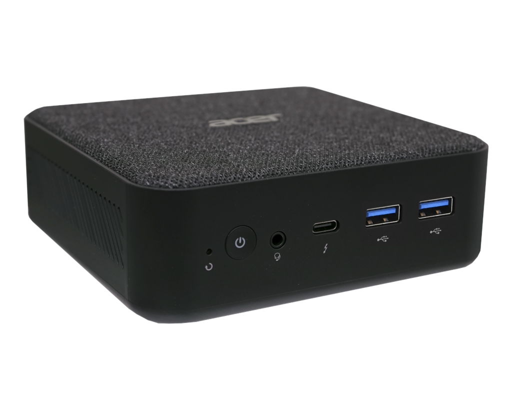 Un mini PC Acer noir avec un dessus en tissu. Il dispose de ports d'alimentation, audio et USB. Le logo Acer est visible.