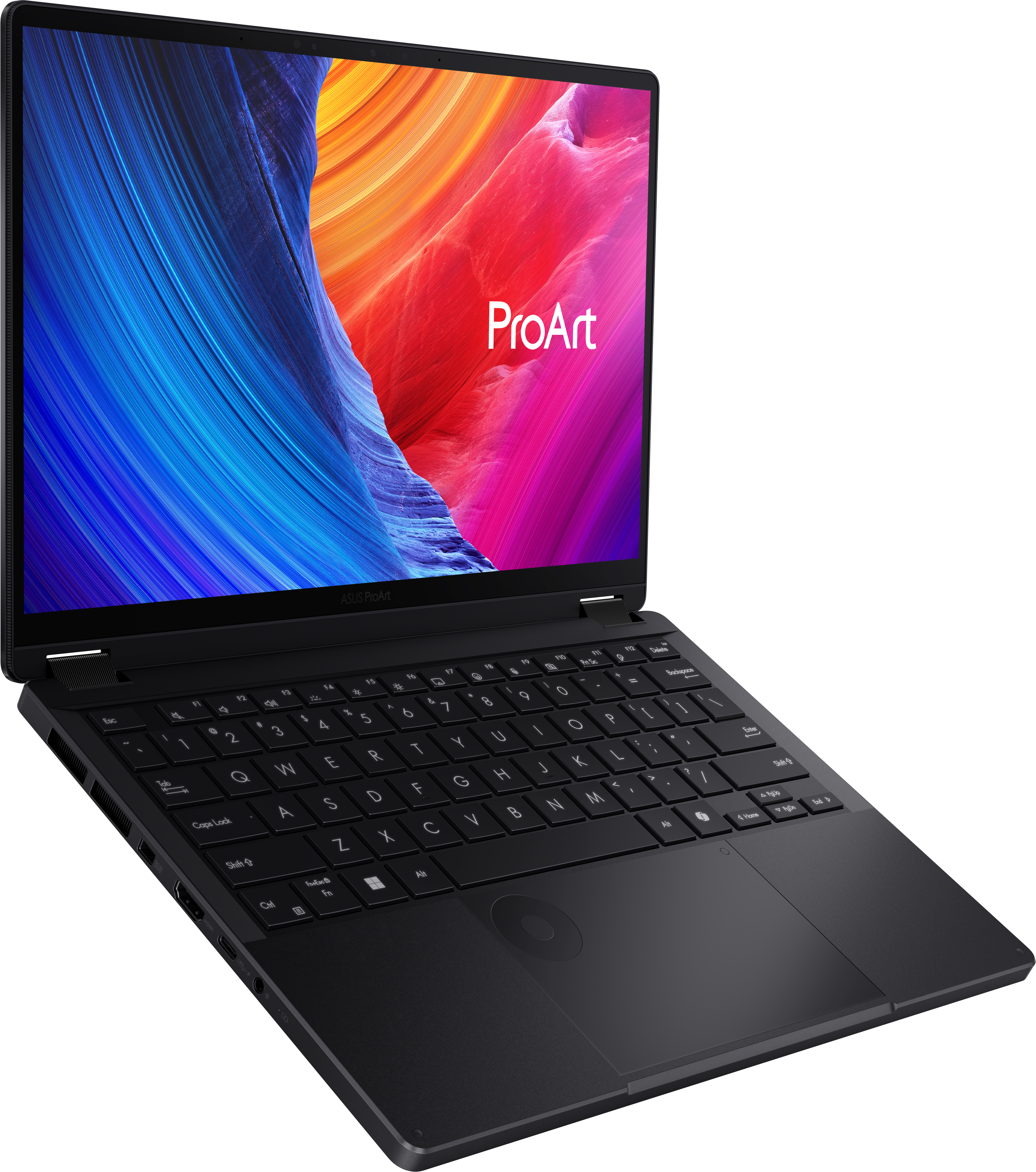 Ordinateur portable noir, ouvert. L'écran affiche une image colorée avec le logo ProArt. Clavier visible. ASUS ProArt est écrit.