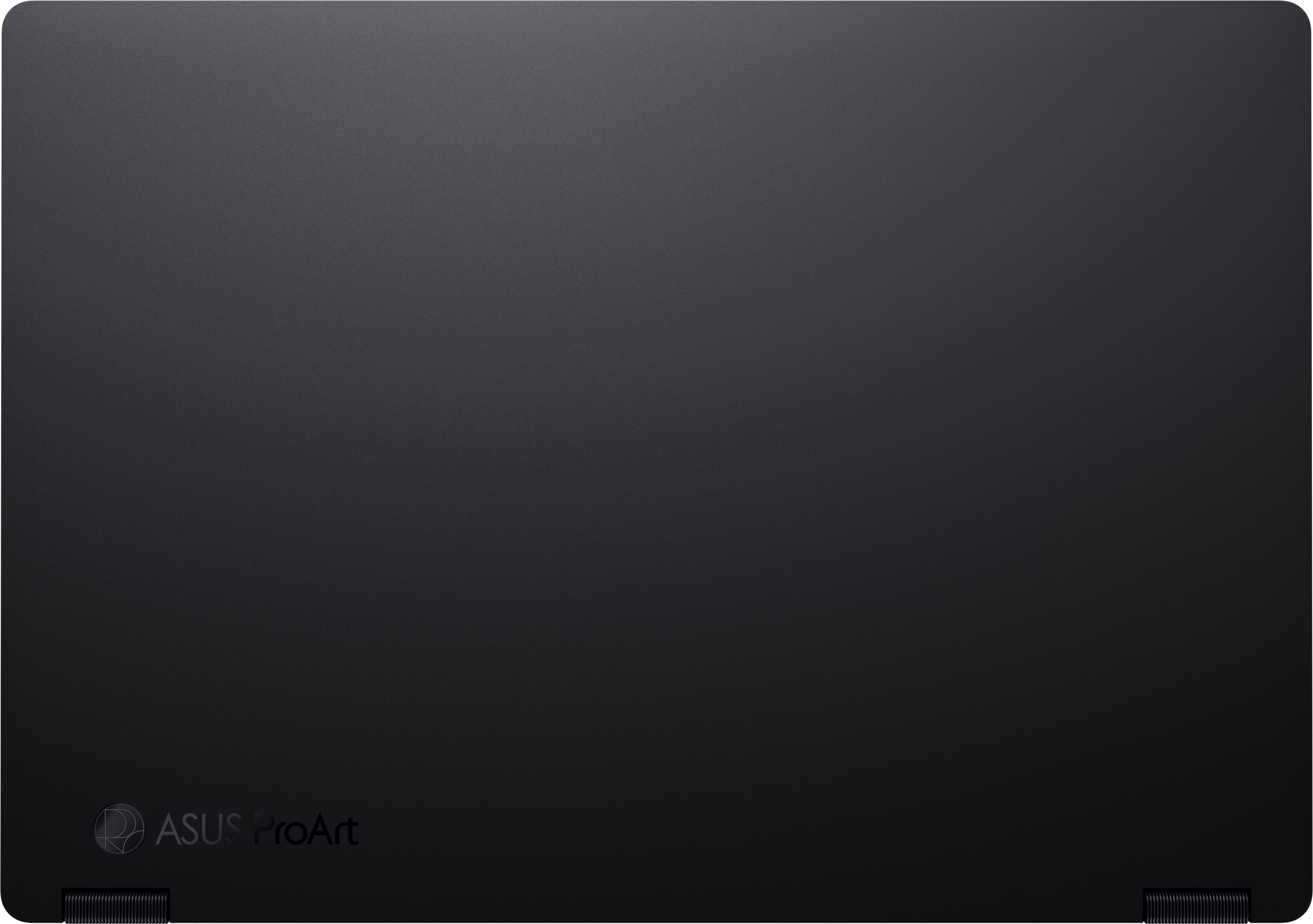L'image montre un ordinateur portable noir fermé avec le logo ASUS ProArt. La surface a une finition texturée. Les charnières sont visibles en bas.