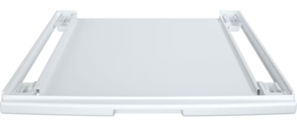 Biała, prostokątna podstawa urządzenia. Ma płaską powierzchnię z podwyższonymi krawędziami i prowadnicami. Podstawa jest czysta i nowoczesna.