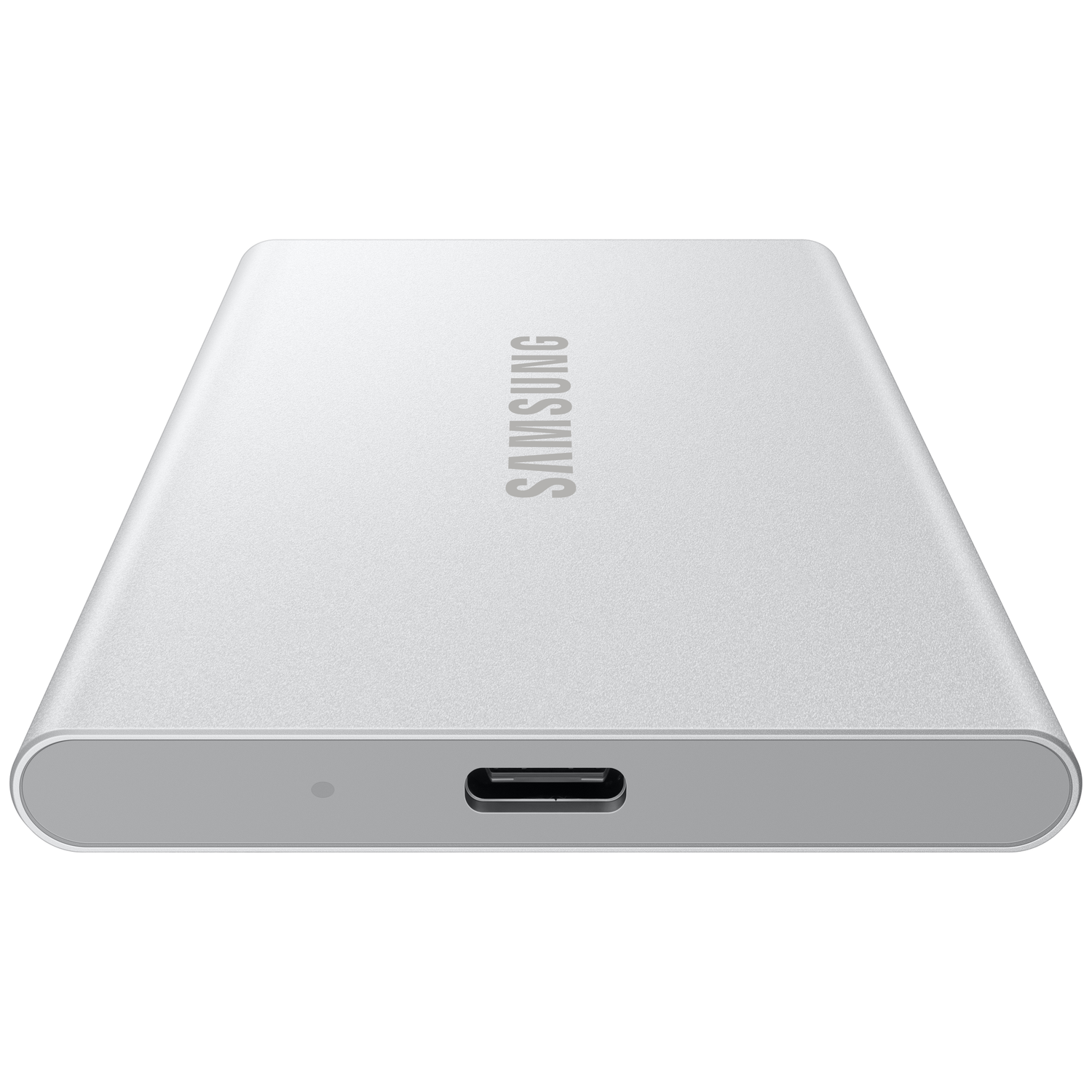 A silver Samsung external hard drive. It has a USB-C port, a small indicator light, and the Samsung logo on the top.